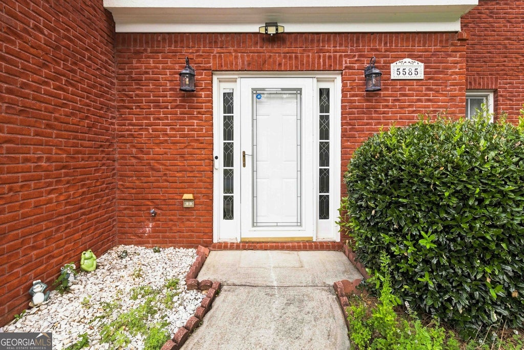 Photo of 5585 Martin Grove Drive NW, Lilburn, GA 30047 (MLS # 10839591)