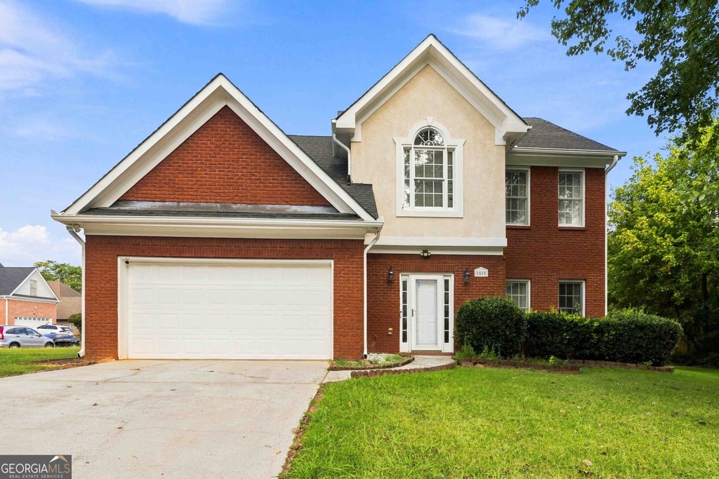 Photo of 5585 Martin Grove Drive NW, Lilburn, GA 30047 (MLS # 10839591)