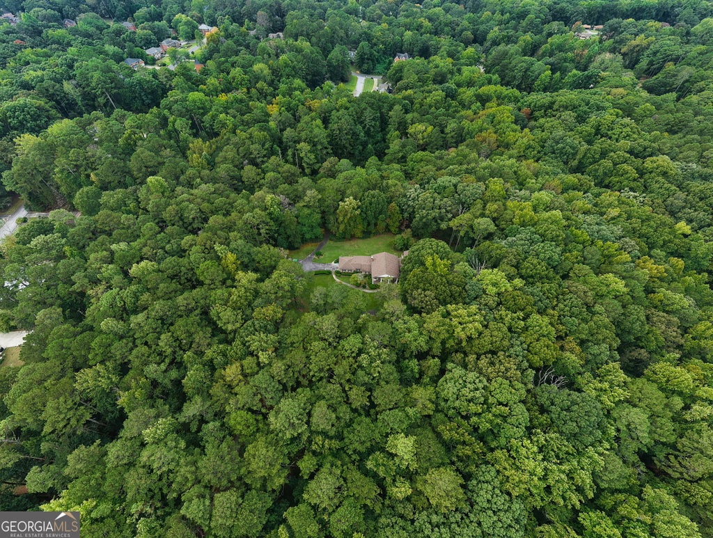 Photo of 4787 Castlewood Drive SW, Lilburn, GA 30047 (MLS # 10867403)