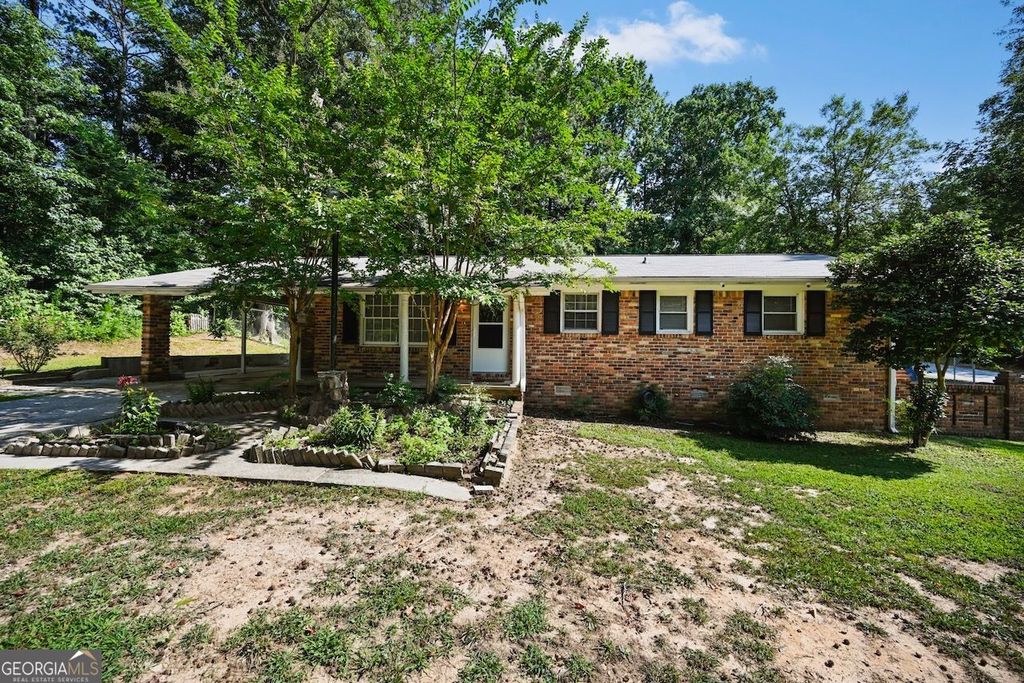 Photo of 7039 Rockbridge Road, Stone Mountain, GA 30087 (MLS # 10712004)