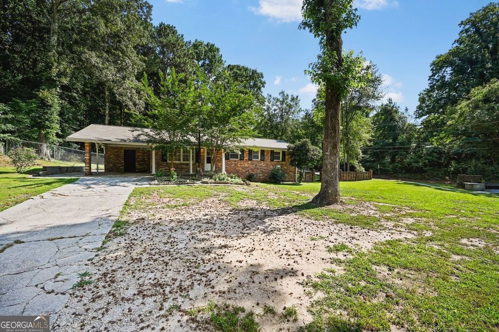 Photo of 7039 Rockbridge Road, Stone Mountain, GA 30087 (MLS # 10712004)