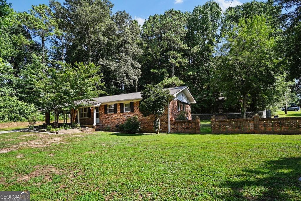 Photo of 7039 Rockbridge Road, Stone Mountain, GA 30087 (MLS # 10712004)