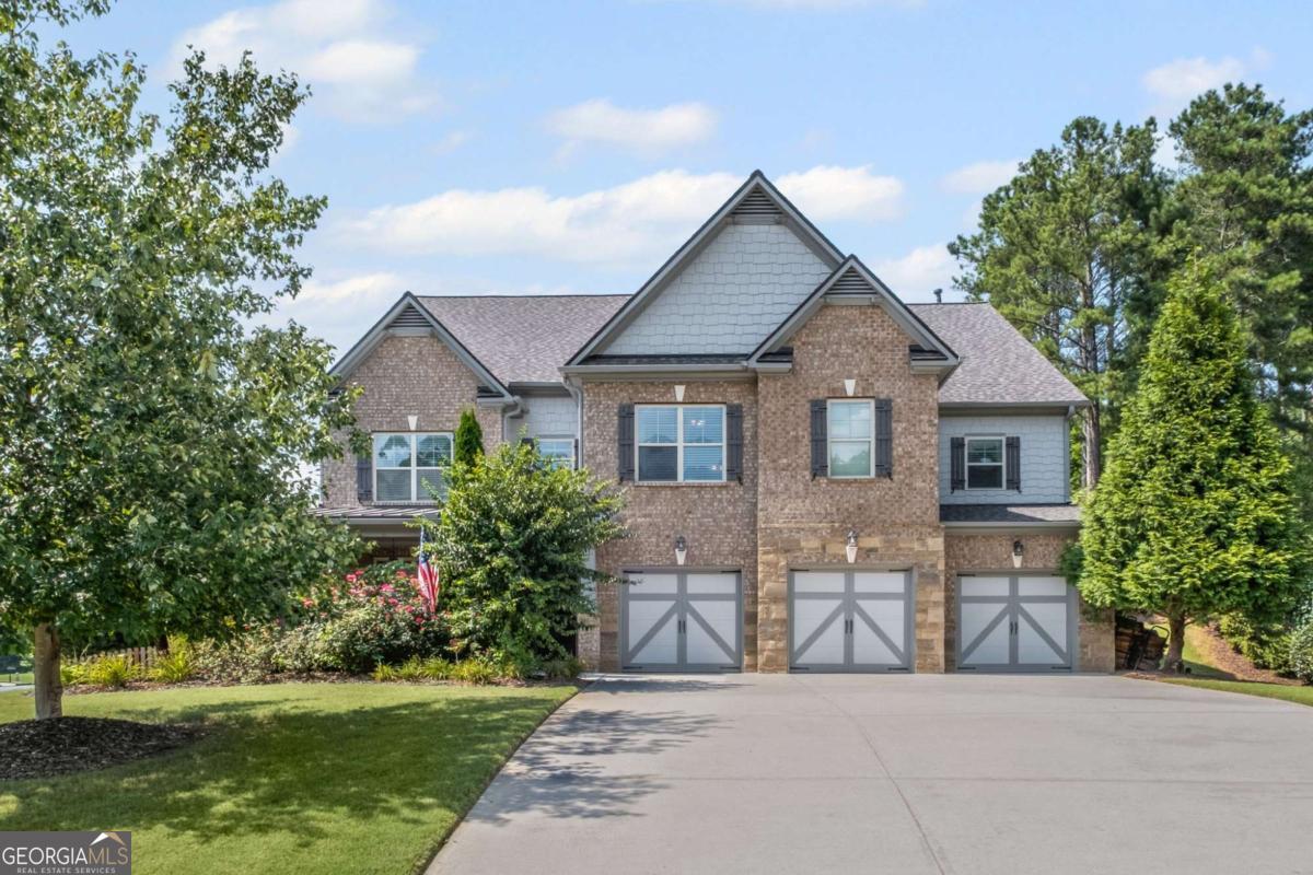 Sought-After Alpharetta Address with Forsyth County Schools & Taxes! Welcome to this beautifully updated and impeccably maintained 6-bedroom, 5-bathroom home in Castille, an exclusive gated community of just 37 executive homes. Situated in a prime Alpharetta location with the benefit of top-rated Forsyth County schools and lower taxes, this home blends luxury, comfort, and convenience. The main level boasts an inviting open floor plan designed for both everyday living and entertaining. Step through the covered rocking chair front porch into a grand two-story foyer. Highlights include an executive home office, a formal dining room with coffered ceilings, a fireside family room, breakfast area, and a cozy fireside keeping room. The gourmet kitchen is a chef's dream, featuring double ovens, stone countertops, stainless steel appliances, custom tile backsplash, two large islands, and ample workspace. A bedroom with a full bath and a mudroom completes the main floor. Upstairs, you'll find a charming reading nook with a custom window seat and built-in bookshelves, a large laundry room with cabinets and sink, four generously sized bedrooms and three full baths. The luxurious primary suite offers a private sitting area, two walk-in closets (including a custom-designed one), and a spa-like bath with a soaking tub, oversized tiled shower, and double vanity. The finished third level includes a full bath, flexible living space, a 6th bedroom, and the option for a 7th-perfect for a guest suite, media room, or home gym. Outdoor living is just as impressive, with covered front and back porches, an expanded patio, a fire pit, and a large, level fenced backyard-ideal for play or relaxation. Enjoy close proximity to Polo Fields, Vickery Village, Downtown Alpharetta, and GA 400-all while coming home to peaceful, private surroundings. With a brand-new roof and true move-in readiness, this home is the total package.
