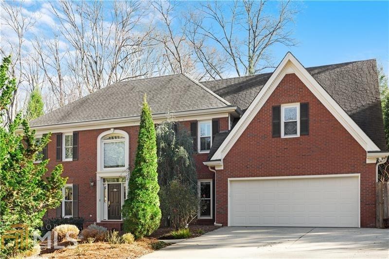 Classic Updated Light-Filled Brick Beauty Set on a Quiet Cul-de-Sac in the Sought After Neighborhood of Dunwoody Heritage! Immaculate and Move-in-Ready this home features all new interior paint, new light fixtures, higher ceilings, spacious rooms, impressive moldings, hardwood floors on both levels, insulated windows, and beautiful backyard with waterfall feature! Elegant two story entry foyer opens to large great room wtih fireplace & bay window, and separate dining room with wainscoting. Chef's kitchen offers custom stained cabinetry, grante countertops and tile backsplash, stainless steel appliances and side bar with prep sink. Rear staircase at back of the house. Walk out to screened porch overlooking private, fenced backyard. Upper level features oversized owner's suite with trey ceiling and renovated marble bath with pedestal sinks, free standing tub and large walk-in closet with professional closet system. Three additional bedroooms, one with ensuite bath and two with shared bath. Full unfinished terrace level. Fantastic location close to private and pubic schools, shopping and restaurants, Perimeter Business District, Dunwoody County Club and Interstates! A real gem!