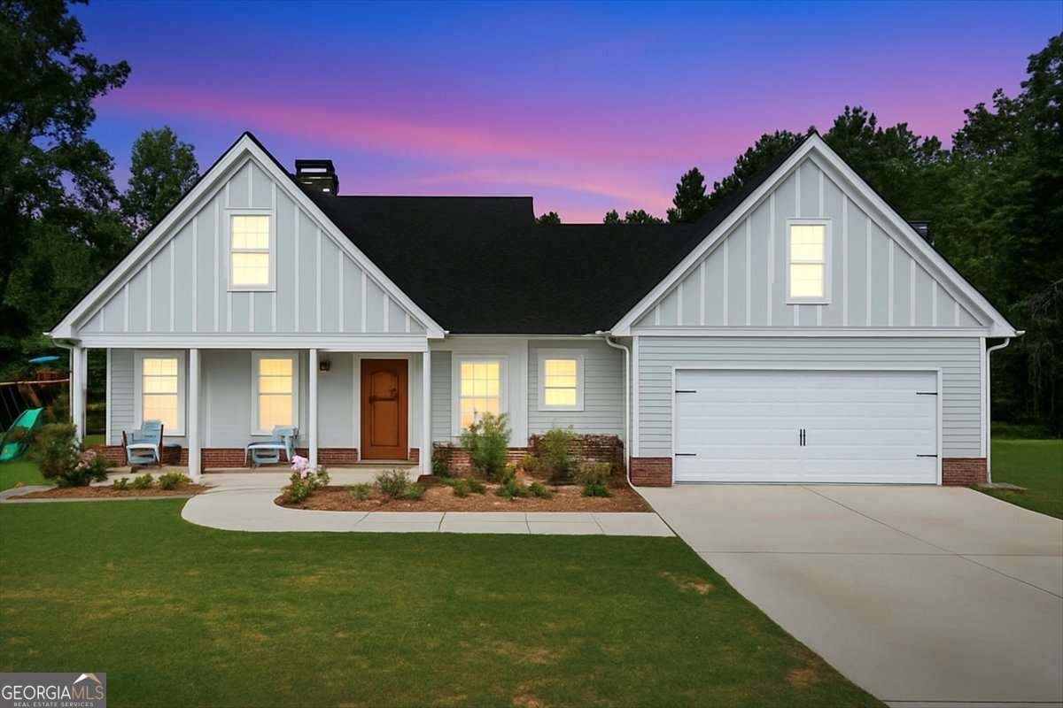 This gorgeous 4-bedroom, 3-bath home is nestled on 6.6 acres of serene country living, offering the perfect mix of privacy, space, and style. With a fresh coat of paint and new Jellyfish lighting that sparkles across the front, this home is as inviting outside as it is inside. Step into the main living area where cathedral ceilings and an open-concept design create a light and airy feel. The chef's kitchen is both functional and beautiful, featuring a large island, farmhouse sink, stainless steel appliances, a walk-in pantry, and plenty of storage. A convenient drop zone off the two-car garage keeps life organized. The luxury vinyl flooring runs throughout the home (bonus room excluded), offering durability and modern elegance. Upstairs, the spacious bonus room/bedroom above the garage gives you flexible space for an office, media room, or guest suite. Outside, enjoy peaceful mornings on the large front porch or entertain on the oversized covered rear patio overlooking the fenced backyard. Don't miss the sunflower garden that blooms each year, adding charm and color to your outdoor retreat. This home is the perfect blend of modern upgrades and country charm, giving you space to breathe and grow while still feeling warm and welcoming.