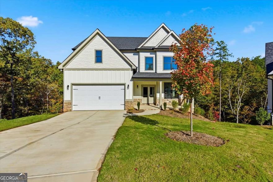 Featuring the "Travis floor plan" features 4 bedrooms, 2.5 baths, along with plenty of open, uninterrupted living space. The Great room is highlighted by a gas log fireplace with views to the kitchen. A haven for cooks, kitchen is equipped with sleek Quartz countertops, high end soft close cabinetry, a large Island, and dedicated breakfast area. Make the most of your space by hosting memorable family gatherings in the formal dining room or relaxing on the back deck. Upstairs, you find an expansive master suite, highlighted by spa-like ensuite master bath with soaking tub and a tile shower, and large walk-in closet. The laundry room is in the second floor for your convenience. Three additional generously sized bedrooms, a full hall bath and linen closet. two-car garage that includes garage door openers. Carter Grove is a well sought after subdivision in Cartersville Ga. This GOLF CART FRIENDLY community includes luxurious amenities including, but not limited to: a large club house, which can be used as an event space or meeting room for residents, gated swimming, tennis, playgrounds, sidewalks, beautiful exterior landscaping, and a short walk to the adjoined Woodland Hills Golf Club. Enjoy the convenience of a short ride to highways, amazing dining, shopping and entertainment in Downtown Cartersville, Red Top Mountain State Park, The Etowah River and Lake Point Station. As an added offer, $5,000 closing cost incentive OR Temporary Rate Buydown when you use our preferred lender, Matt Garcia w/ Supreme Lending .