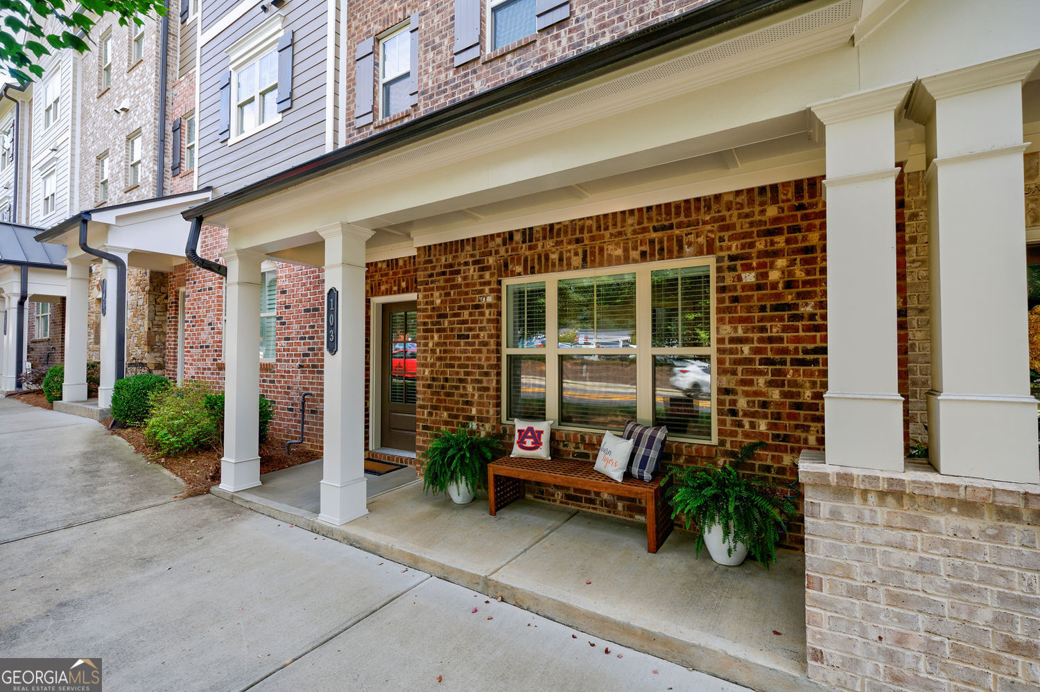 Welcome Home to Downtown Woodstock. Just steps from all the shops, restaurants, boutiques, and charm that make Downtown Woodstock so special, this inviting 3 bed / 3 full bath / 1 half bath townhome offers comfort and convenience in equal measure. Enjoy being minutes from the city's amphitheater, where fabulous summer concerts and community events fill the season with music and memories. The main floor features 10' ceilings, fresh paint throughout, and thoughtfully chosen Rejuvenation light fixtures that blend timeless style with modern comfort. An open floor plan connects the spacious kitchen, walk-in pantry, and covered deck - perfect for family gatherings or quiet evenings at home. Upstairs, the generous primary suite offers 9' ceilings, two large closets, and convenient access to the laundry room. A cozy junior suite ensures family and guests feel right at home. The entry level provides flexibility with a second junior suite - equally suited for guests, hobbies, or a home office - plus a welcoming foyer and an oversized storage closet. Even the two-car garage has been updated with a fresh epoxy floor in colors that complement the home's design. A comfortable home with thoughtful details, just around the corner from concerts, community, and all the best of Downtown Woodstock.