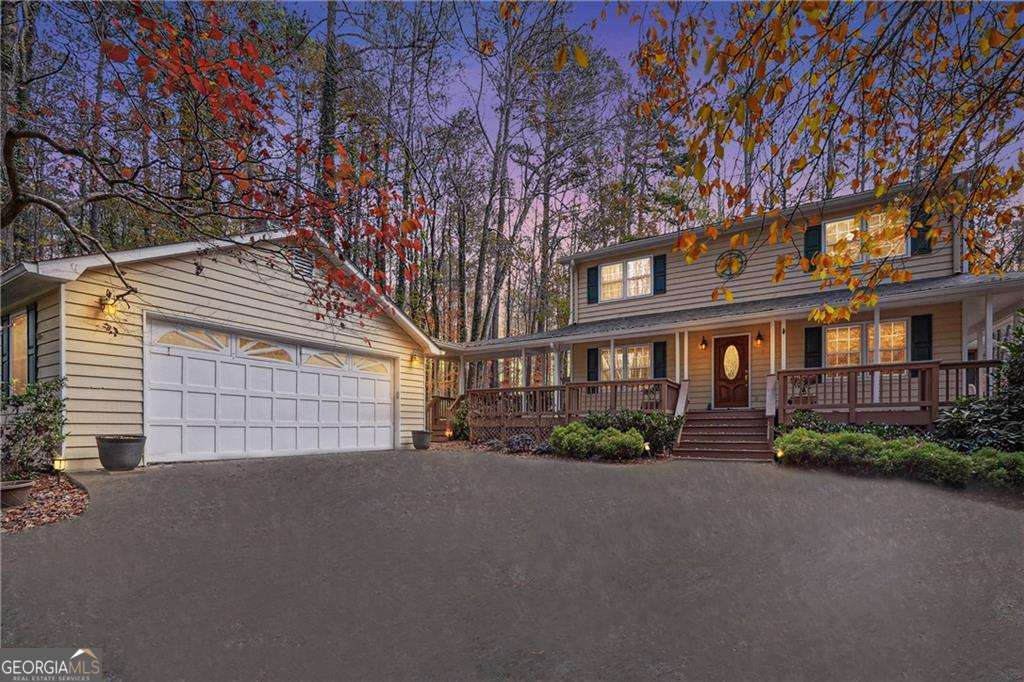 Rare 1.7-acre lakeside retreat in the heart of Marietta. Land value alone is worth asking price. $15,000 esthetic design/update allowance with the approved offer. Current updates include New Stove & Microwave (2021), Aquaguard Gutter System installed (March, 2024), New Shower & Sink in basement bathroom (March, 2024), Replaced Roof (2023) and New Garage Door Openers (December 2023). Home features a wrap-around porch, a screened sunroom, and a massive deck, all offering stunning views of the private lake. Inside, the spacious living room is centered around a cozy fireplace and flows seamlessly into the formal dining room. Gourmet kitchen boasts white countertops, cabinets, and a sunny breakfast nook. Primary suite offers a relaxing haven with an ensuite bathroom that includes a shower room and walk-in closet. Two additional bedrooms and a full bath are located on the upper level. Property also includes a detached two-bay garage, ideal for vehicles or extra storage. With its breathtaking lake views and modern amenities, this home offers the perfect combination of tranquility and convenience. Schedule your private showing today!