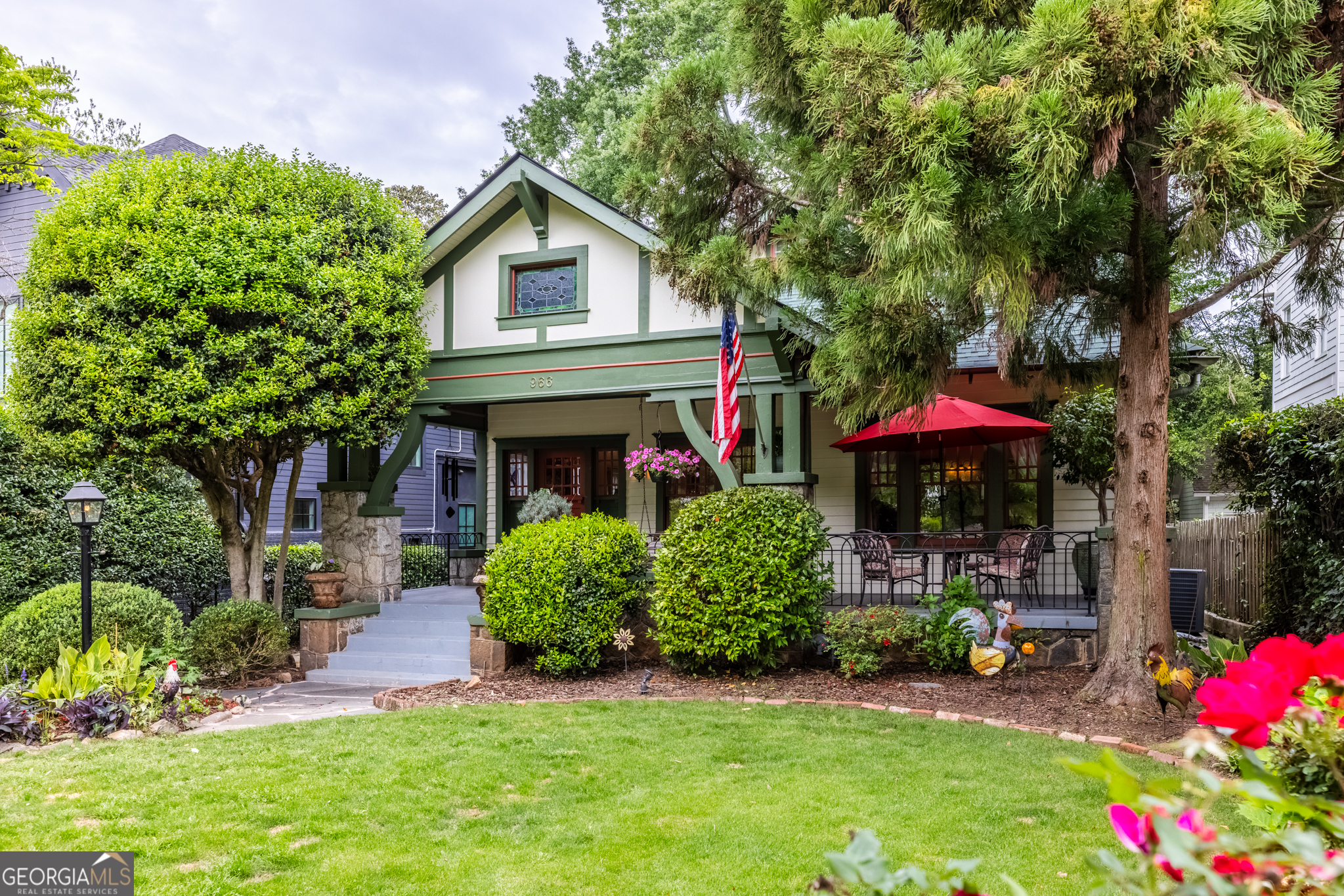 LARGER THAN IT LOOKS for this 1920 Craftsman! This home has been lovingly updated with a down to the studs renovation blending historic charm with modern convenience. With only three owners in its history, this home has been cared for with immense pride and attention to detail. A beautiful gas lamp lights your way to the bungalow-style front porch where you can relax with a morning coffee or evening glass of wine while chatting with neighbors. Inside, the home opens to a spacious living room anchored by a large wood-burning fireplace, windows filling the room with light making the space full of warmth and character. Entertain in style in the formal dining room, complete with a full wet bar and enjoy making culinary masterpieces in the chef's kitchen featuring: granite counter tops, Viking range and oven with hood vent, hanging pot rack, large island with a vegetable sink, and hang out in the sunny eat-in breakfast area! The primary suite includes an ensuite bathroom with a clawfoot tub, while the second bedroom offers abundant natural light and charm. A half bath in the hallway completes the main level. Upstairs, you'll find two more generously-sized bedrooms, a full bath, a laundry area, and an adorable reading nook or kids' play corner. Downstairs, the fully finished terrace level offers amazing flexibility-use it as a fifth bedroom suite, separate kids area, in-law apartment, or income-producing rental. It includes: bedroom, full bath, kitchenette, living space, and separate entrance and laundry area. Plus, there's an expansive daylight basement-perfect for a workshop with a vice and compressed air hoses all ready to go, a gym, or extra storage. Relax or entertain in your private backyard that includes a vintage a 1950s BBQ pit, hot tub, and kids' tree house. Additionally there is an EV charging station that is conveniently located next to the parking pad. There is an ability to access to the alley way in back that connects to Linwood, or take over the alley and extend your backyard! So many add-ons to list! Yard is fenced with a functioning remote controlled iron gate with an invisible fence for the dogs, NEST subscription with four cameras and two thermostats and more! Over 3200 sq/ft, spacious rooms, 10 ft ceilings and a bonus of dry basement space of 1000 sq/ft Let's talk about location! Walking/biking distance to everywhere! Easy access to the Beltline, Ponce City Market, Va/Hi, Inman Quarter, Poncey Highland businesses, L5P, Carter Center Farmer's Market to name a few! What a great place to live! This is more than just a home-it's a piece of history, lovingly restored and ready for its next chapter.