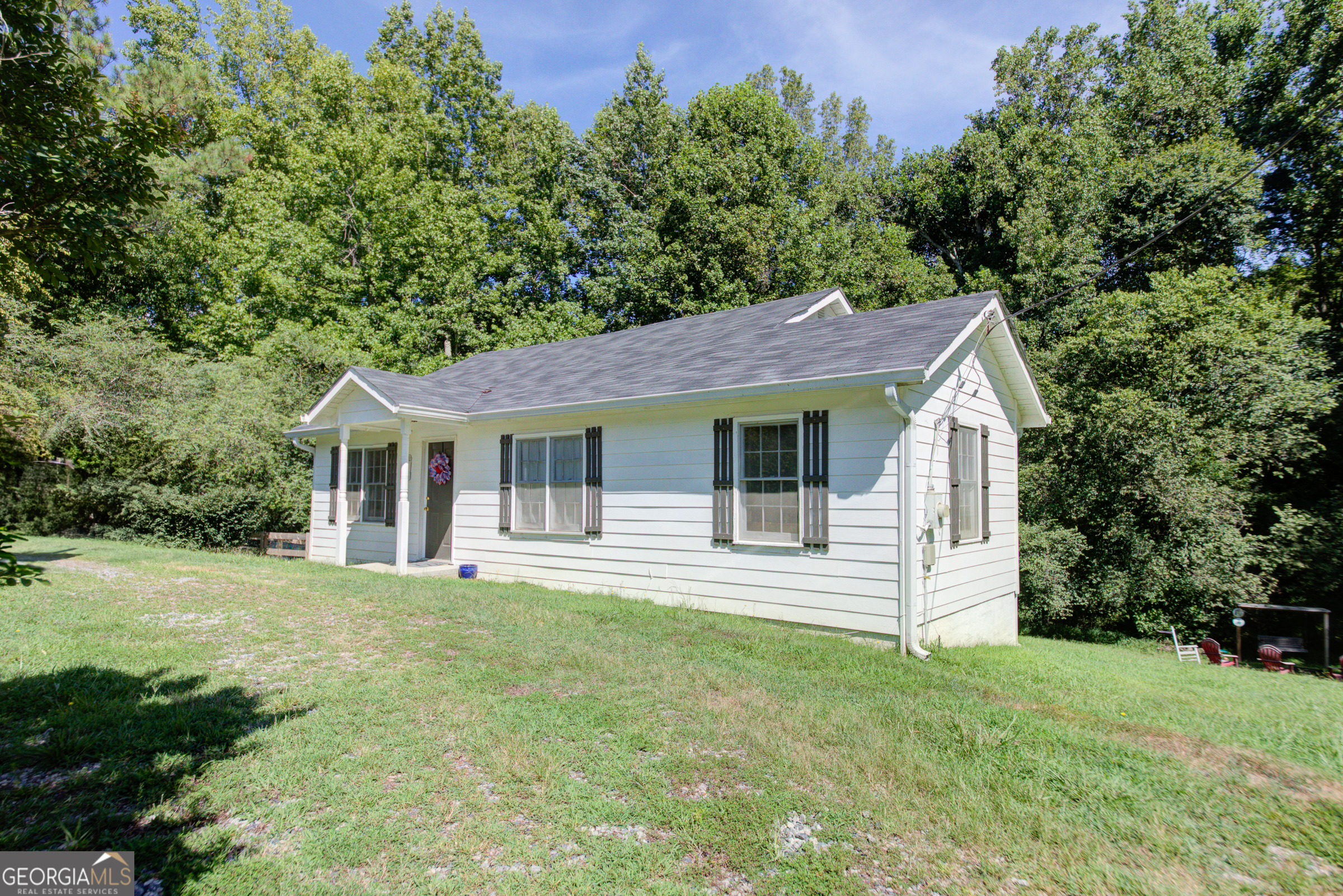 Welcome to 7335 Westray Rd - an adorable, move-in ready ranch home located in the heart of Cumming and zoned for the highly sought-after Forsyth County schools. Listed at just $275,000, this charming 2-bedroom, 2-bath home with a versatile bonus room offers the perfect combination of style, function, and affordability. Fully renovated in 2023, the home features an open-concept living and kitchen area that is both spacious and inviting-ideal for entertaining or enjoying cozy evenings at home. The kitchen flows seamlessly into the living space, creating a warm and welcoming atmosphere. The additional bonus room offers endless possibilities-use it as a home office, playroom, guest space, or creative studio. Both bedrooms are generously sized. Step outside to enjoy your private yard. The fenced side yard is perfect for pets or gardening, and the large open backyard offers plenty of room for play, entertaining, or relaxing by the fire pit. An outbuilding provides extra storage or space for hobbies and tools. Whether you're a first-time homebuyer, retiree, or investor, this property has something for everyone. Nestled in a quiet area but still close to local shopping and dining, this home provides the perfect balance of convenience and comfort. Don't miss this incredible opportunity!