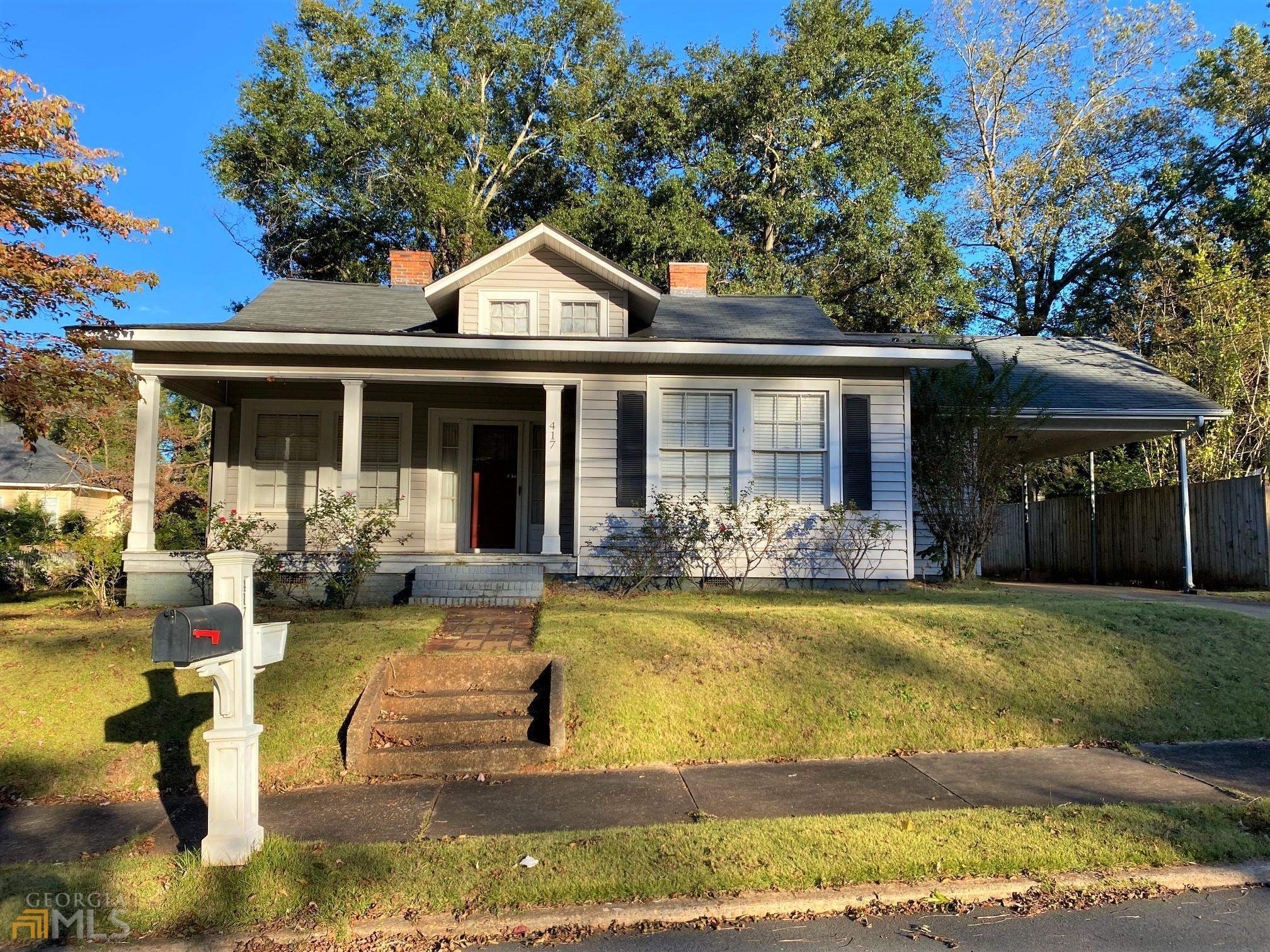 Adorable city home has 2-3 bedrooms, large kitchen, liv.rm., dining room, large laundry room, central h/a, attached carport. Old cottage charm with rocking chair front porch and original hardwood floors. Located just a few blocks from the downtown entertainment district with shopping & dining within walking distance and also near Upson Regional Medical Center.