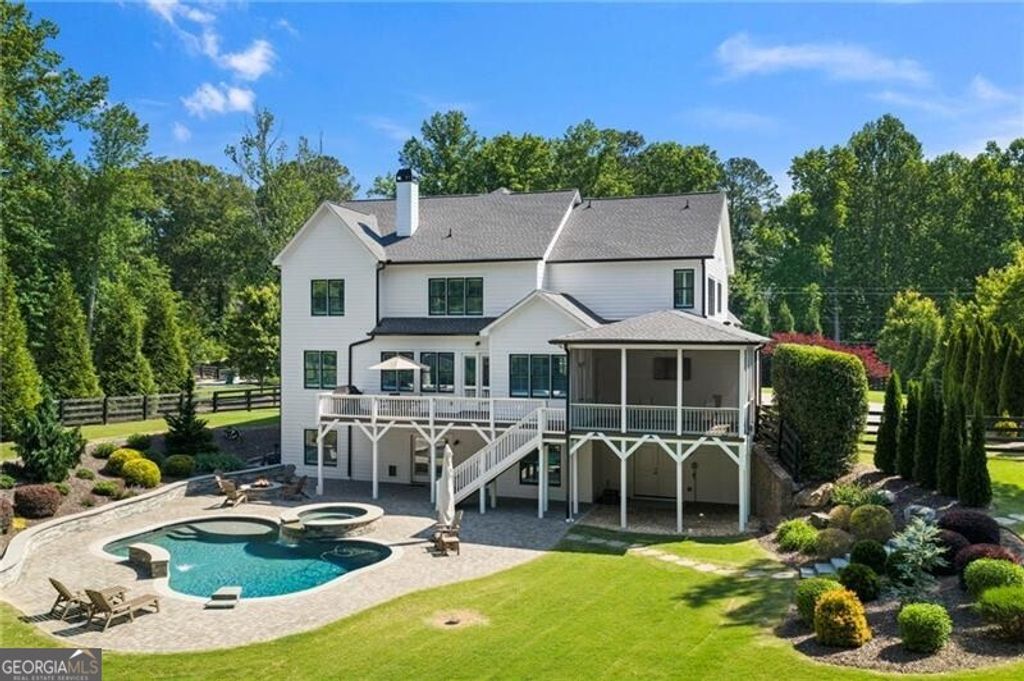 Photo of 14200 Cogburn Road, Milton, GA 30004 (MLS # 10767381)