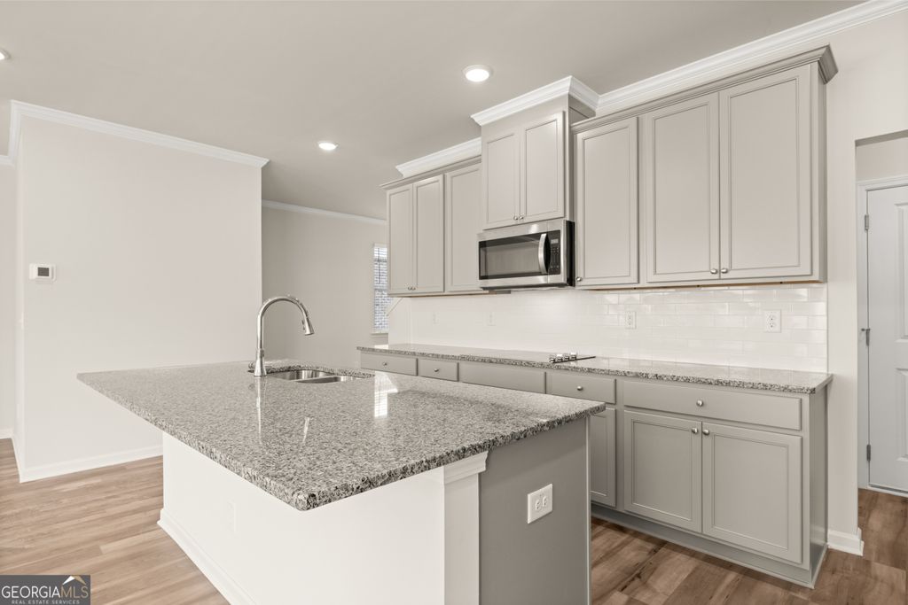 Photo of 732 Ellis Spring Way #LOT 70, Lawrenceville, GA 30045 (MLS # 10678773)