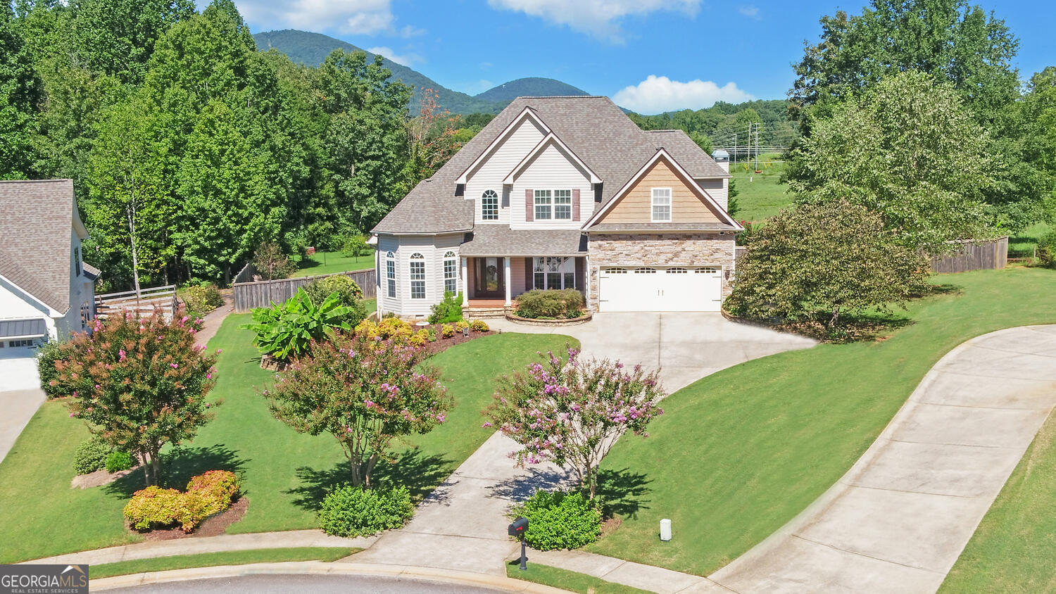 Stunning Clermont Station Home with Mountain Views Welcome to this beautiful home in Clermont Station Subdivision, perfectly positioned on a cul-de-sac lot in North Hall County. With breathtaking mountain views, access to a community pool, and even a private workshop in the backyard, this property is ready for its next owner to enjoy. From the street, you'll be impressed by the charming curb appeal and bold stance of the home. Step inside to a grand 2-story foyer that flows seamlessly into a spacious family room with fireplace and a formal dining room-ideal for entertaining. The owner's suite on the main level is a private retreat with a separate tub and shower, double vanities, and a walk-in closet. The kitchen offers granite counters, abundant cabinet storage, a large pantry, breakfast bar, and eat-in area-all with a view into the cozy keeping room with its own fireplace. A large utility room and convenient garage entry complete the main floor. Upstairs, you'll find three large bedrooms, a Jack-and-Jill bath, and ample storage throughout. The two-car garage is equipped with a Level 2 electric car charger, adding modern convenience. Step outside and enjoy the backyard, where the workshop and relaxing outdoor atmosphere make it feel like you're on vacation every day. A 3 year old roof, 2 HVAC less than 5 years old add to the value of 3445 square feet Beauty. Don't miss your chance to own this incredible home in a sought-after neighborhood-schedule your showing today!