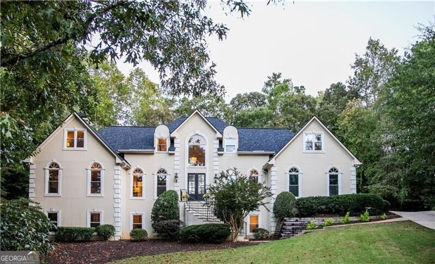 Sophisticated Roswell Retreat in a Coveted Swim/Tennis Community Discover the perfect balance of luxury, comfort, and convenience in this exceptional executive home, ideally located on a private cul-de-sac in one of Roswell's most desirable neighborhoods. Just minutes from the boutiques, restaurants, and historic charm of Downtown Roswell, this residence offers the ultimate blend of lifestyle and location. Step inside the grand two-story foyer and be welcomed into a sun-filled, open-concept floor plan designed for both refined entertaining and everyday living. The soaring fireside family room, framed by dramatic windows, flows seamlessly into the gourmet kitchen and formal dining spaces, creating an effortless setting for gatherings of all sizes. The main-level primary suite is a private sanctuary featuring a fireside sitting area and a newly renovated, spa-inspired bath. A rare second en-suite bedroom on the main floor provides ideal accommodations for guests, in-laws, or multi-generational living. Upstairs, three spacious bedrooms and an oversized bonus room offer flexible options for teens, play, or media space. The fully finished daylight terrace level expands the home's living potential with a large family room, private office, bedroom, full bath, and additional bonus room-perfect for a home gym, hobby studio, or future bedroom suite. Outdoors, enjoy a beautifully designed stone patio with a freestanding fireplace, creating the perfect setting for al fresco dining or evening relaxation. With fresh designer paint, a brand-new roof, and professionally maintained hard-coat stucco, this home is as move-in ready as it is timeless. Zoned to Roswell's top-rated schools and surrounded by premier private academies, it offers convenience to top dining, shopping, and entertainment-many accessible by golf cart. More than just a home, this is a lifestyle of elegance, space, and distinction.