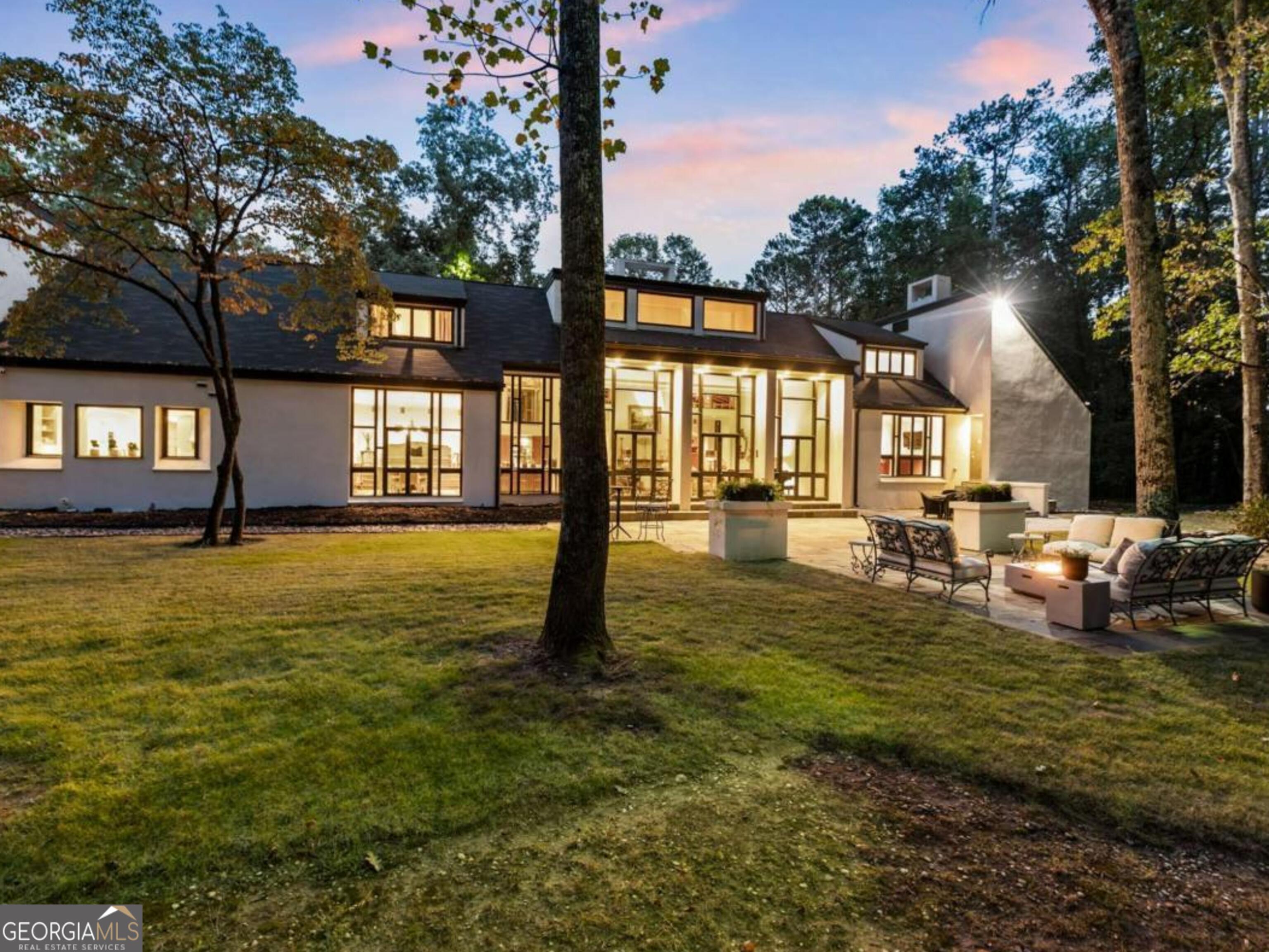 10.95 acres zoned for +-5 homes or create a family compound with the current mid century modern home.