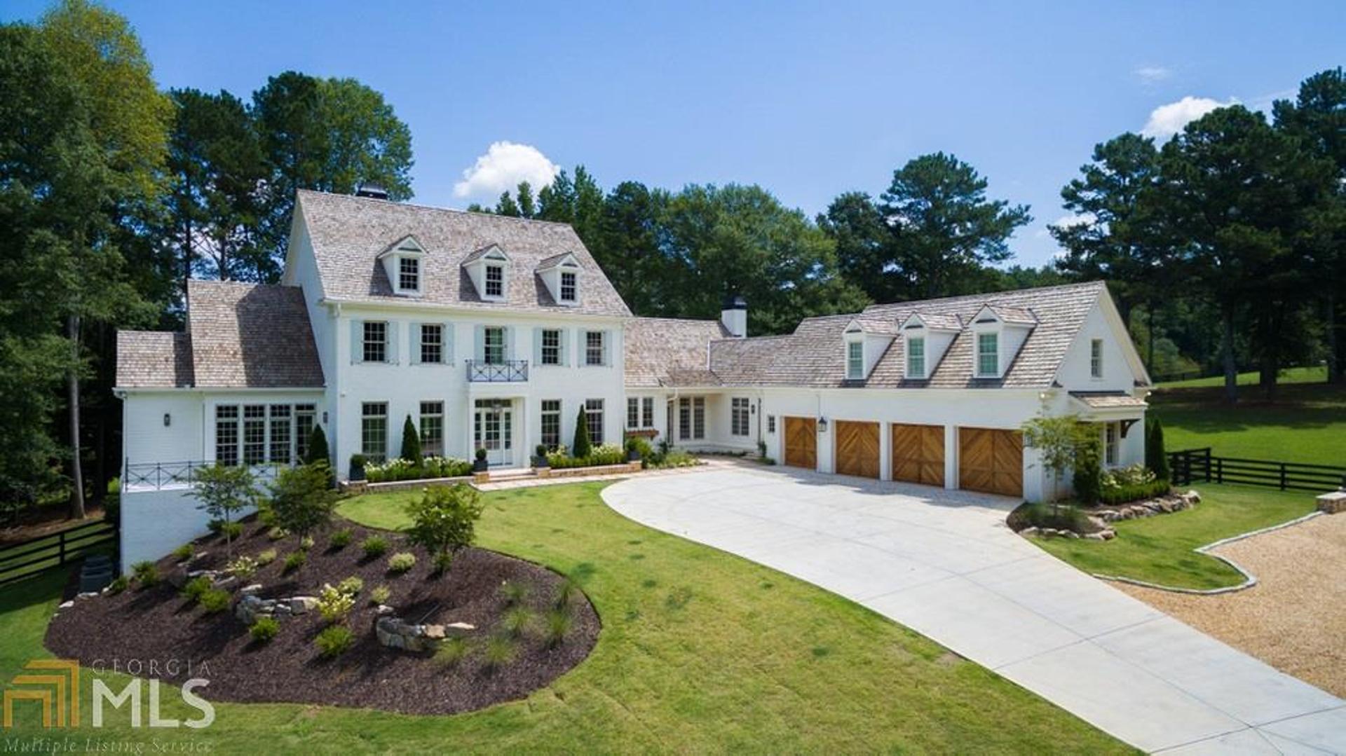 Stunning Newly built Private Estate home located on 7+ acres overlooking Providence Lake. This amazing custom built home is just minutes from Downtown Alpharetta and Avalon. An entertainer's dream with every architectural detail imaginable. Chef's kitchen with Sub Zero and Wolf appliances, custom cabinets with two huge islands, open to Family room overlooking the backyard oasis, which includes a pool and 33 acre lake. Gorgeous separate Dining Room, Butlers pantry with ice maker and wine cooler. Separate den with fireplace, exquisite millwork throughout home. Master on main complete with separate steam shower and soaking tub. Master opens to private patio overlooking lake. Huge his and her closets with custom built-ins. Smart Home with the latest technology including security system with cameras covering full exterior of the home. 11 ft ceilings on main, 10 ft on second and basement, Ensuite on first floor with separate shower and soaking tub. Office on main with custom built-ins, formal and informal powder rooms. 3 large bedrooms upstairs, each with private bath. Two Laundry rooms, upstairs and on main. 4th bedroom upstairs can be used as in-law suite, has private bath, refrigerator, microwave and dishwasher.