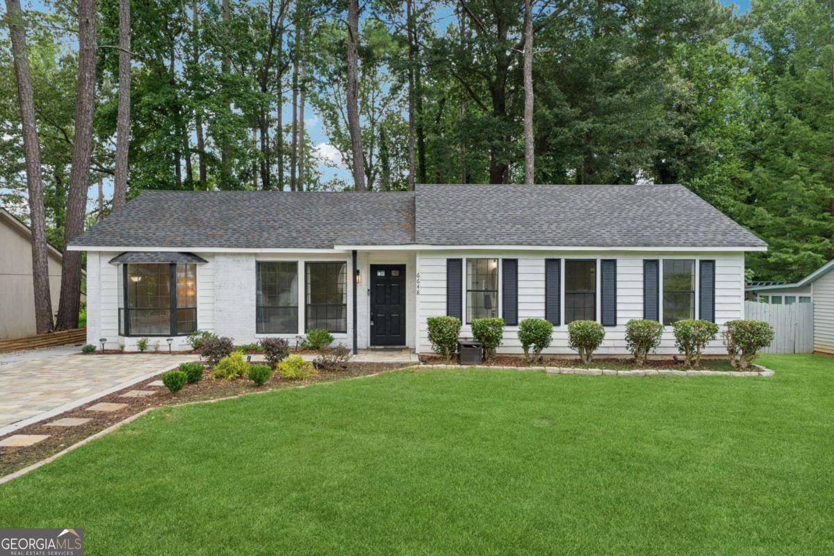 Look no further, welcome to this beautifully updated 4-bedroom, 2-bathroom Ranch style home. As you walk up to the front door make sure to note the exquisitely done paver driveway! This home offers the perfect blend of location and lifestyle. This fully renovated home has been impeccably reimagined for a new homeowner to make it their own. The kitchen features upgrades to make it a true focal point, featuring striking cabinetry, solid wood countertops, and sleek appliances - ideal for entertaining and everyday living. Walk into the living room that features Vaulted Ceilings and a space with plenty of natural light. A spacious primary bathroom offers an expansive shower and modern finishes. Enjoy serene outdoor living in your huge, landscaped yard that comes complete with a fire pit. Backyard is fenced in to add to the privacy the lot offers. With easy access to the shopping, dining, and entertainment near Atlanta (I-20 is 2 mins away), this home offers both tranquility and convenience. Truly move-in ready - modern, comfort, and location all in one. This home is waiting for you to make it yours!