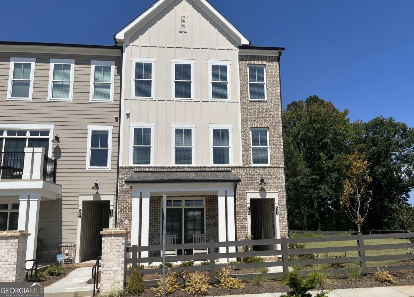 Be the First to live in this Stunning BRAND-NEW-END-UNIT Townhome, offering 2 bedrooms, 2.5 baths, and a Spacious Open-Concept Layout designed for Modern Living. On the Main level, enjoy an Open-Concept Family Room, Dining area, and Chef-style Kitchen featuring 42" white cabinets, Quartz countertops, Stainless Steel Appliances including an Electric range and Vent hood, a white tile backsplash, and Beautiful Hardwood floors. The seamless flow extends to a Spacious private outdoor Deck, perfect for Relaxing or Entertaining. The Third level welcomes you to a large Primary Suite with a walk-in closet and a spa-like bathroom complete with a double vanity and walk-in shower. An additional ensuite bedroom ensures comfort and privacy for family members or guests. A convenient half bath is located on the main level for added ease. This home comes Move-in ready with all Appliances included-Refrigerator, Washer and Dryer. Located in the heart of Cumming, GA, the property is within walking distance of schools and the public library, and just minutes from shopping, dining, and entertainment at the Cumming City Center. Quick access to GA-400 makes commuting and weekend getaways easy. With its walkable location, modern design, and nearby conveniences, this home is a great place for families looking to enjoy both comfort and community. Residents also have the option to join the community pool and amenities for an additional cost. Don't miss the chance to call this Beautifully Finished Townhome your next home! Call today to Book Showing. GPS Address: 540 Dahlonega St, Cumming, GA 30040