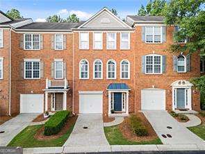 Fantastic opportunity to own a beautifully updated townhome in the heart of Roswell! Units in Views at Coleman Village rarely hit the market, and this one checks every box. 2022 Merrimont Way features brand new flooring throughout, a stunning designer kitchen with quartz countertops, new cabinetry, and stainless steel appliances. Fresh paint brightens every room, while the spacious deck offers private, wooded views - perfect for relaxing or entertaining. The terrace level includes a welcoming foyer, a full bedroom and bath, a mudroom leading to the backyard, and a one-car garage. Upstairs, the sunlit main level is an entertainer's dream with an open-concept fireside great room, modern kitchen, powder room, and a large deck. The top floor features a serene primary suite with custom shiplap accents and a spacious walk-in closet, as well as two additional bedrooms and a full bathroom. Enjoy unbeatable convenience - minutes from downtown Roswell, the Riverwalk, Avenues at East Cobb, GA 400, and top-rated schools. Don't miss your chance to own this move-in-ready gem!
