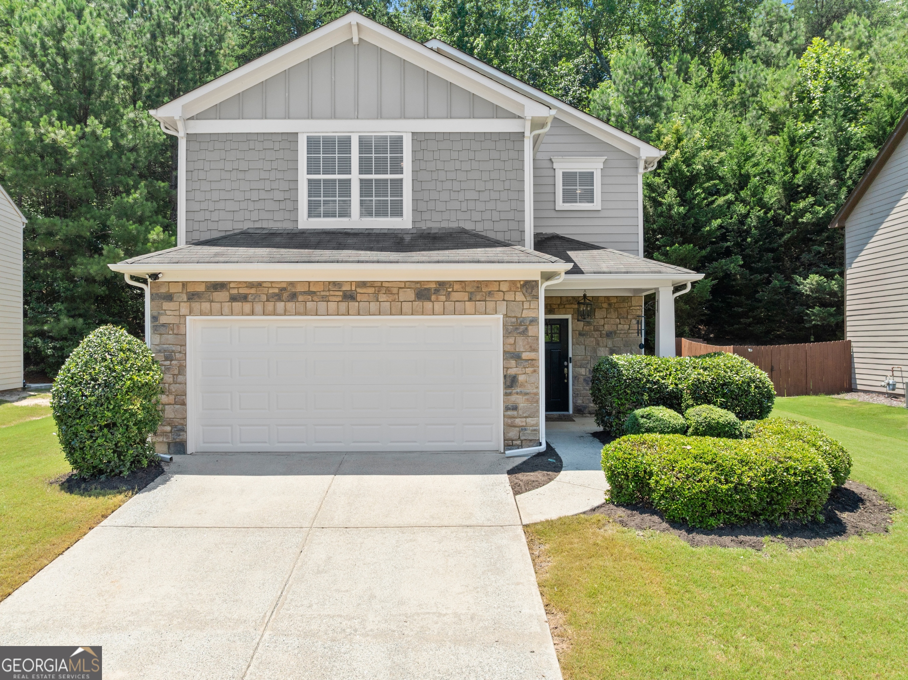 Located just one mile from Lake Lanier, this beautifully maintained home is situated in the highly desirable community of Sugar Hill. The open-concept floor plan features a spacious dining area and an eat-in kitchen with granite countertops-perfect for both everyday living and entertaining. The main level includes a versatile bedroom that can also function as a home office or guest suite. Upstairs, a large landing offers additional flexible space-ideal for a second office, playroom, or media area. This low-maintenance property is part of an active HOA community with swim and tennis amenities. With ample living space, stylish finishes, and a prime location near Lake Lanier, this home offers the perfect blend of comfort, convenience, and lifestyle.