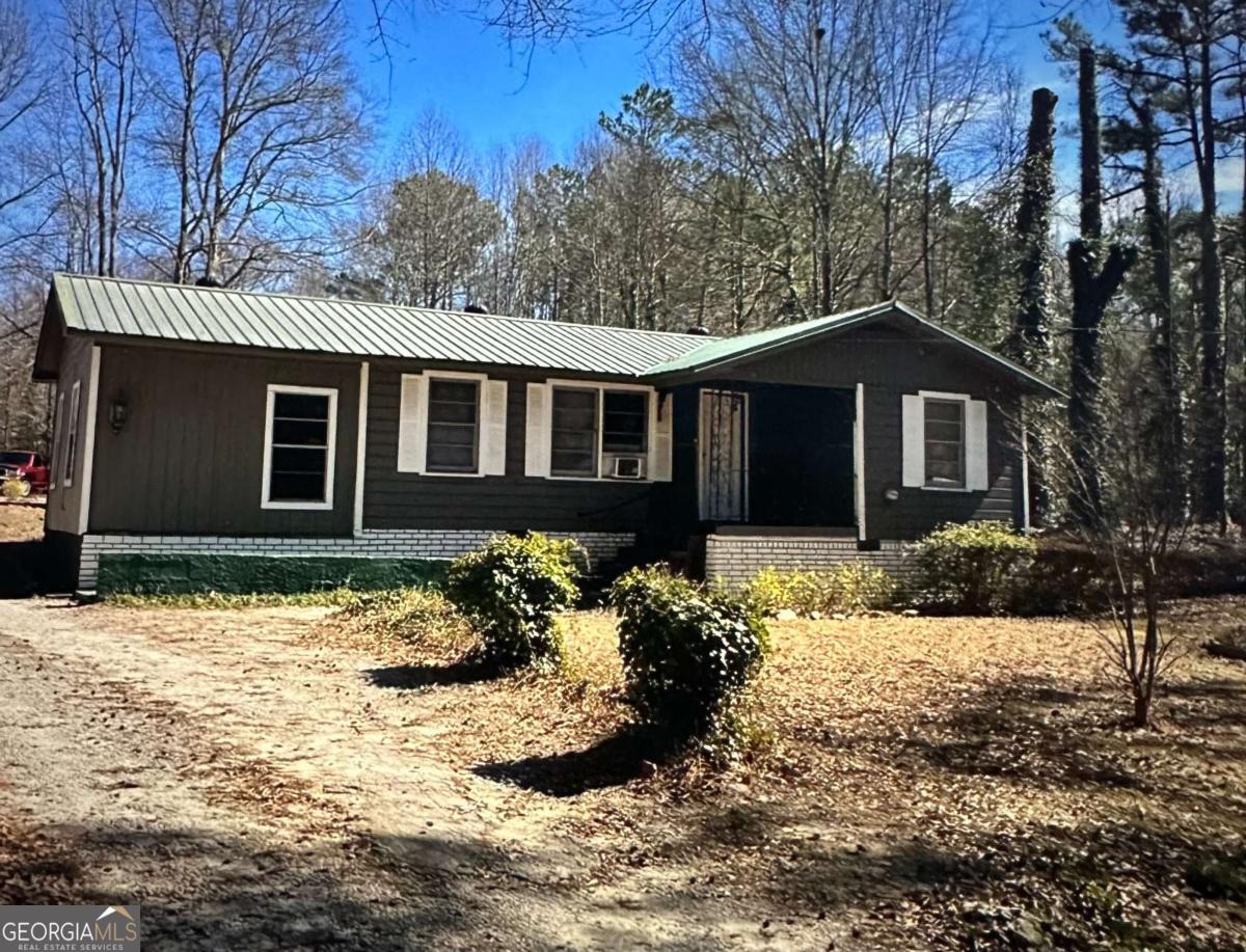 INVESTOR OPPORTUNITY! TWO PARCELS SOLD TOGETHER, totaling nearly three-quarters of an acre of flat, usable land in prime Douglasville. The existing home is a full renovation project-ideal for a flip, rental, or new construction. With both lots included, this property offers rare flexibility: renovate the current structure, build new, or explore multi-home development potential. Sold AS-IS-bring your contractor, vision, and ideas. MOTIVATED SELLER WELCOMING ALL OFFERS, READY TO NEGOITATE AND MOVE QUICKLY. Schedule showing through showing-time.