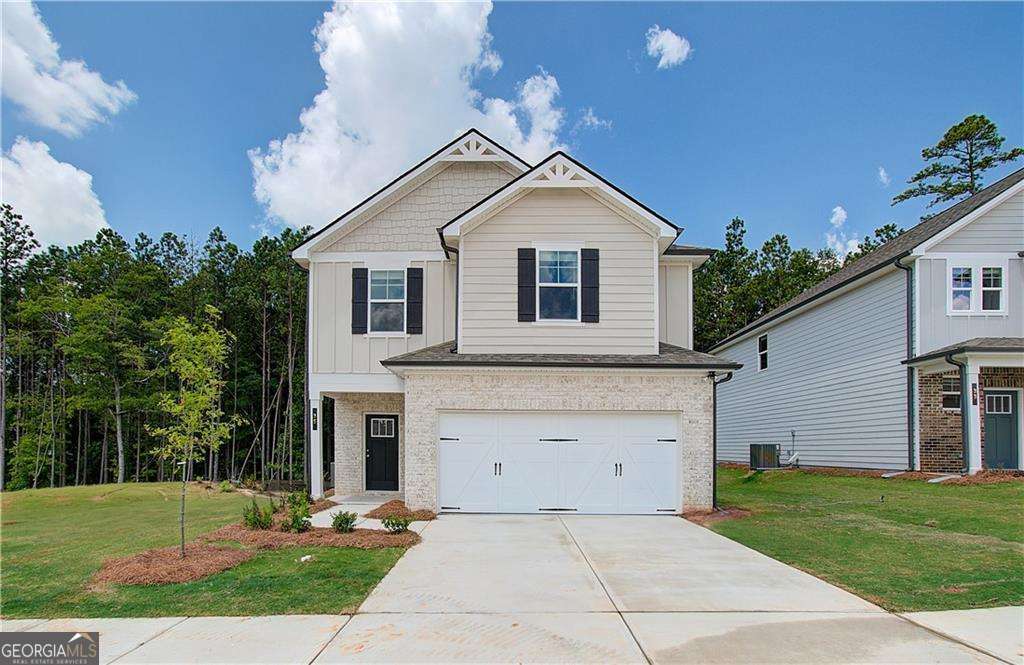 Welcome to the Reagan at Homesite 5 in the desirable Enclave at Evergreen community by DRB Homes! This beautifully crafted 4-bedroom, 2.5-bathroom home offers the perfect balance of style, comfort, and modern functionality. The open-concept kitchen is a centerpiece of the home, featuring a large island that overlooks the dining area and family room-ideal for hosting gatherings or enjoying cozy family nights. Upstairs, the expansive owner's suite is a private retreat with volume ceilings, a spacious walk-in closet, and a luxurious en-suite bathroom complete with dual vanities, a soaking tub, and a walk-in shower. A versatile loft area upstairs provides additional space for an office, playroom, or second living area. Extra conveniences include a main-level laundry room and a mudroom located just off the garage, designed to streamline your daily routine. *Note: Photos may not reflect the actual home. Explore the Reagan today and envision your future in this exceptional home!* Please note: If the buyer is represented by a broker/agent, DRB REQUIRES the buyer's broker/agent to be present during the initial meeting with DRB's sales personnel to ensure proper representation.