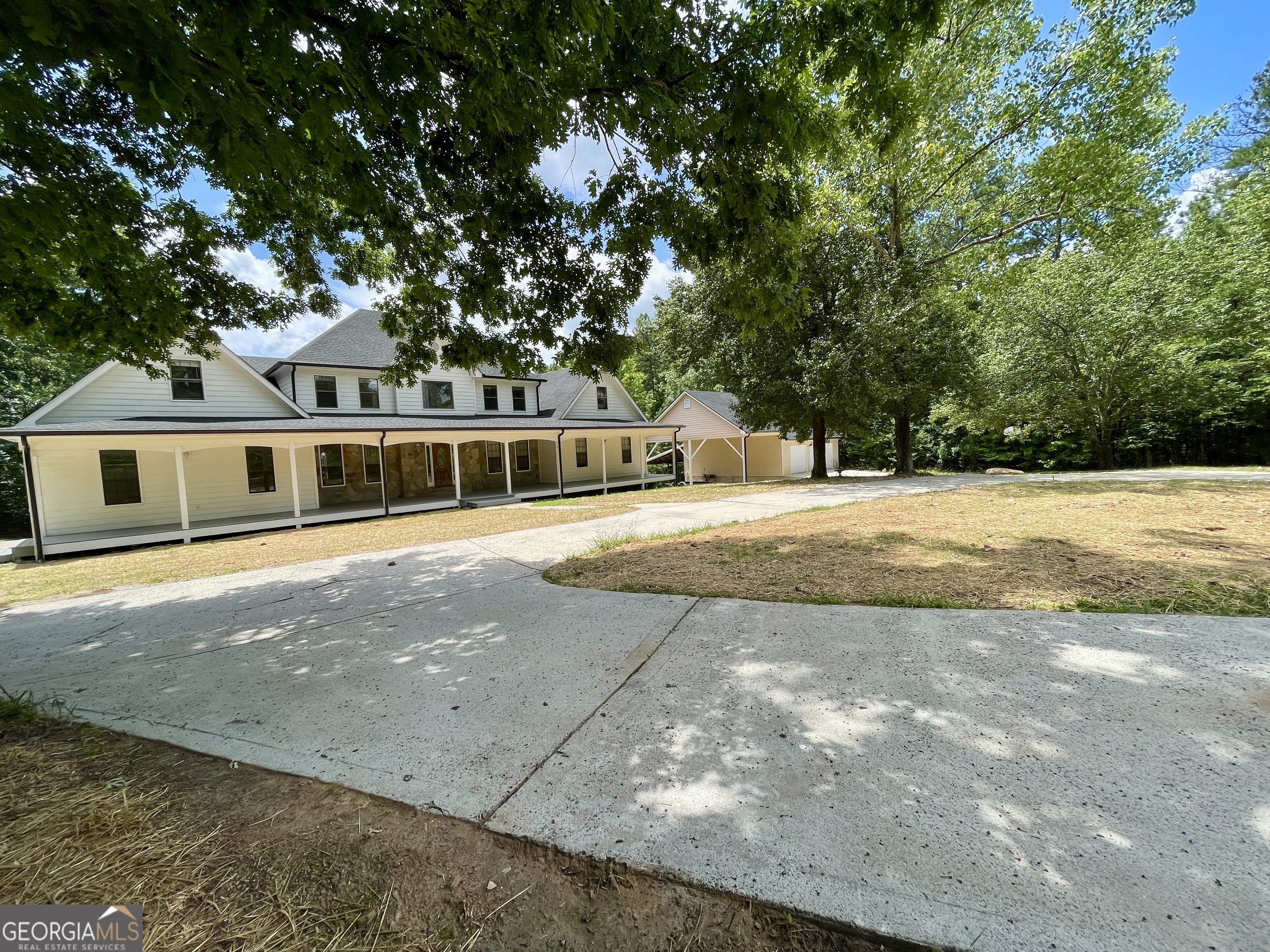 Rare "King of the Hill" opportunity - for sale assemblage of 2 lots totaling almost 12 acres on top of the mountain (5097 and 5098 Gwendolyn Ct)! IF you are lucky, you might have two chances to buy this house and land... now at this price, or in a few months post renovations when it will be worth almost double it, if not more... which one would you prefer?? For a limited time you have the opportunity to get this house at this pre-reno price, which usually only wholesale investors get a chance to, IF you make your move before the seller changes his mind and does the project himself. With over 7,000 square feet of living space, 12 private acres featuring a pond, and a mountaintop setting, the value is unmistakable. Nestled at the end of a cul-de-sac with no HOA, a private circular driveway, and surrounded by top-rated schools and multimillion-dollar estates, this is truly The One on top of the mountain. Location, location... you got it!! Everything is at your feet, quite literally! It is just a few minutes from major shopping and restaurants, from I-75, and from Lake Acworth Beach and Lake Allatoona and much more recreational activities with Red Top Mountain near by. With your own private pond and dock, it is possible for you to go fishing between, or while you are in a zoom meeting! This is your vacation lifestyle disguised as a primary residence, only, this glory of the early 90s needs to be reminded it is 2025. ?? Key Features: * Two garages: An attached 2-car garage on the main (kitchen level) plus a detached garage with adjacent RV AND Boat carport, and room for a workshop, or to build another apartment for your entourage * Main-level oversized primary suite with bath and large walk in closet * Sunroom with panoramic views of the backyard and pond * Upstairs wing includes space for a second primary suite, three large bedrooms, and the potential for a media room or flex space. There is also room for two more bathrooms upstairs * Walk-out basement apt: Full kitchen (demoed), 2nd laundry, potential for 2+ bedrooms, living & dining rooms, and bonus rooms with private entry * Separate formal dining room, family room, and a large kitchen with more room to grow overlooking the party size deck * No HOA and located on a private cul-de-sac * Private pond with a dock * Two Laundries, one large enough to convert into a dreamy butler's pantry This is a true multigenerational home, ideal for extended families or those needing separate living space, or live and work headquarters. While the original hardwood floors offer timeless warmth worth preserving, yes, the popcorn ceilings may go-but the bones are solid, the space is generous, and the potential is limitless. The two car attached garage, not to be confused with the other two car, boat and Rv detached garage, is on the same level as the kitchen. Seller has already started the work with new roof, new deck, and demo of the basement kitchen, the rest is waiting for you with limitless possibilities. The home remains gracefully occupied and is filled with a curated collection of personal pieces that speak to decades of meaningful living. Once after due diligence, the property will be thoughtfully cleared, offering a blank canvas for the next chapter of elevated living. Combined, this property offers a rare 12-acre mountaintop retreat-a serene, elevated setting unlike anything else on the market. This isn't just a listing. It's a legacy opportunity. This glamorous lifestyle change is being sold as is, but free of personal items! Listing price is well bellow appraised value. Don't wait-opportunities like this don't come twice. If they do, you will probably have to pay double the price!