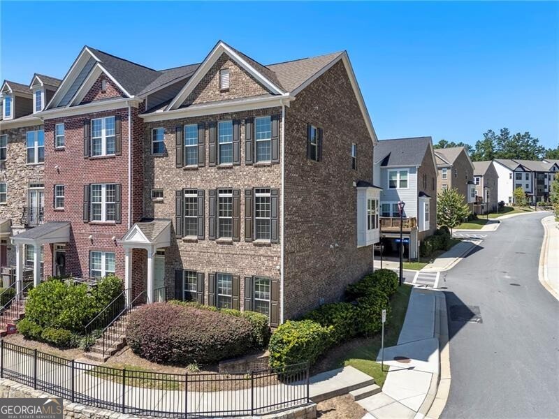 NEW LISTING - Pristine Brick Townhome in Sought-After Decatur Community! Welcome to 2059 Falls Park Way - a turnkey four-bedroom, three-and-a-half-bath residence in one of Decatur's most desirable swim and tennis communities. This all-brick END UNIT townhome combines timeless curb appeal with modern functionality, offering the perfect blend of comfort and convenience. Inside, you'll find an open and light-filled floor plan with spacious living and dining areas, ideal for entertaining. The chef's kitchen features Kitchen Aid stainless steel appliances, granite countertops, and ample cabinetry. The fireside family room provides a warm and inviting space to gather, Open dining area with butlers pantry/ bar perfect for entertaining, while the private deck is the ideal spot for morning coffee or evening relaxation. Upstairs, the LARGE PRIMARY SUITE impresses with a spa-like bath and generous walk-in closet. Two additional bedrooms upstairs offer versatility for family, guests, or a dedicated home office. A finished terrace level features a fourth bedroom and full bath for more flexible living space. Enjoy low-maintenance living with HOA-covered landscaping in a friendly, amenity-rich neighborhood that includes swimming, tennis, and walkable green space. Conveniently located near shopping, dining, parks, and top schools, this home is truly move-in ready. Contact to schedule your private tour today!!