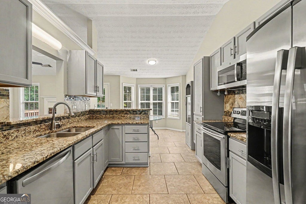 Photo of 524 Martin Forest Lane SE, Lawrenceville, GA 30045 (MLS # 10843262)