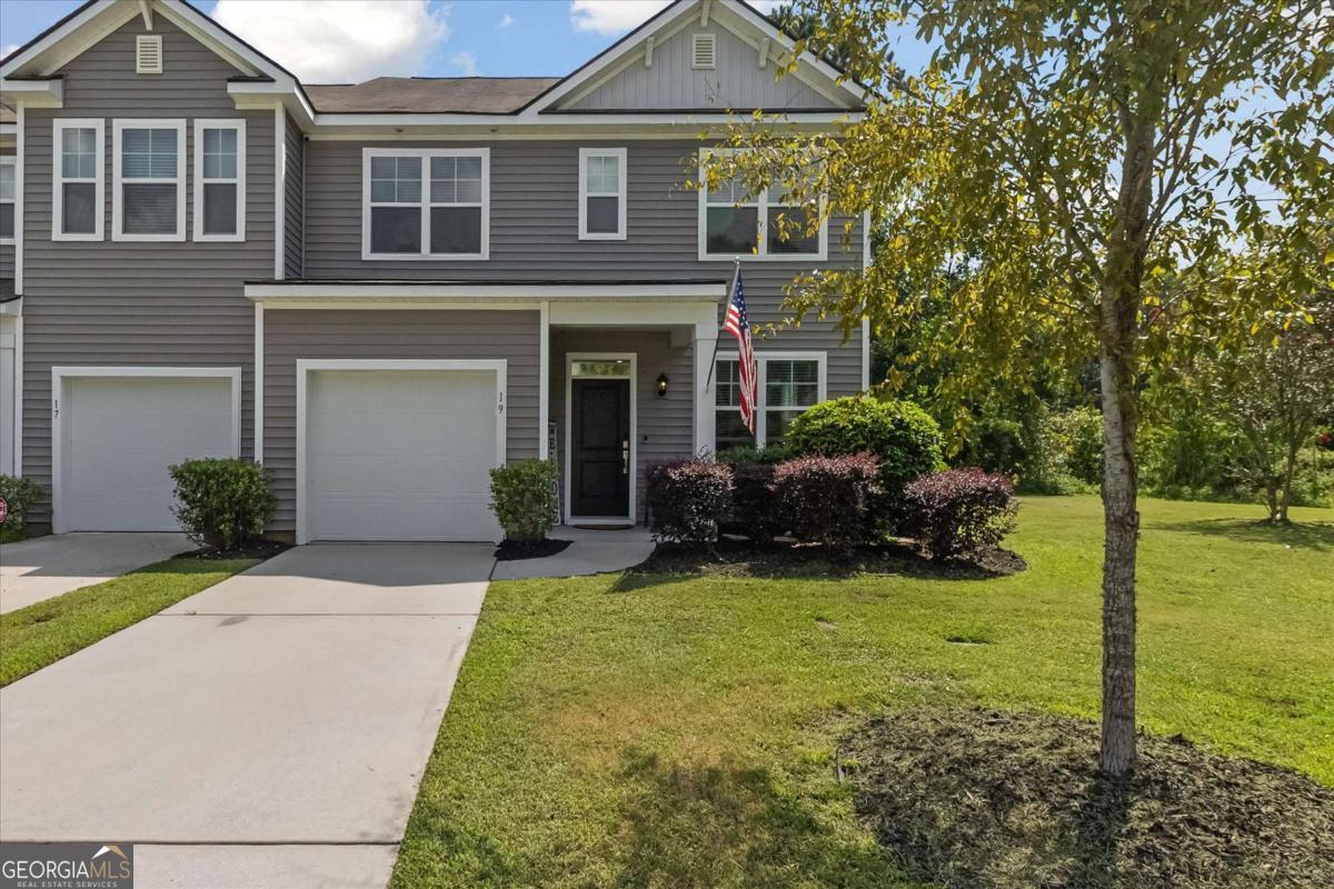 Beautiful, well-maintained, modern Townhome less than 10 min. to Hunter Army Airfield and all Savannah has to offer! This property features a gated community, all landscaping maintained by the HOA, end-unit location, green-space/park adjacent, wooded privacy to the back. Interior Highlights: Abundant natural light, LVP flooring, stunning high ceilings, modern stainless steel appliances, spacious pantry, main floor primary suite w/ double vanities and a large walk-in closet with custom shelving, two separate family room/dens, upstairs landing for office or flex space, upstairs W/D connections, custom closet and storage shelving, mechanical blinds for large high windows, additional storage in attic with custom racks for bins. Exterior Highlights: Gated community, landscaping included in HOA, end unit, single car garage w/ parking pad, park next door (great for pets and kids!), 9 min. to Hunter AAF, less than 15 min. to Grocery, Retail, I-95, and more!