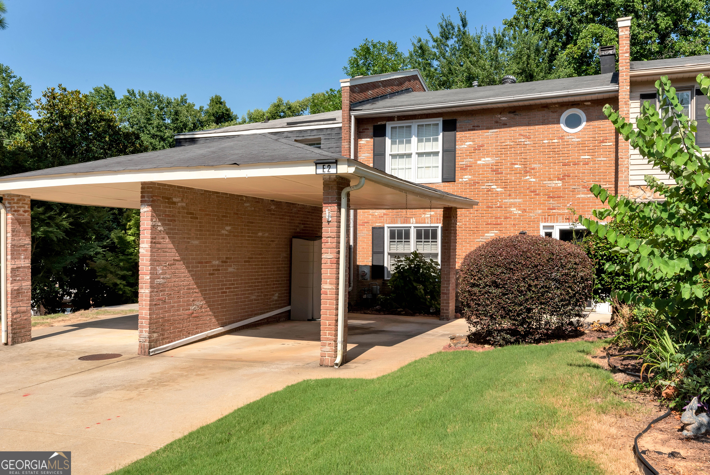 Welcome to this beautifully maintained 2-bedroom, 1.5-bath condo in the desirable lakeside community of Cinnamon Cove. This spacious unit offers exceptional value and comfort, featuring a cozy family room with charming built-in bookcases and a fireplace, plus a private deck and enclosed sunroom with peaceful wooded views. Upstairs, you'll find two generously sized bedrooms with ample closet space, a stylishly updated full bath with shower/tub, and a convenient half bath on the main level. Just steps from your door, enjoy community amenities including a pool, tennis courts, clubhouse, and walking trail to the lake. Located near Van Pugh Park with boat ramps, swimming, and picnic areas. Also close to downtown Flowery Branch's festivals and Farmers Market, as well as shopping, dining, Publix, Target, Home Depot, and lakeside favorites Pig Tales and Fish Tales. Just minutes to Mall of Georgia and about an hour to Atlanta Hartsfield-Jackson Airport. Enjoy low-maintenance, lakeside living in a serene and convenient location!
