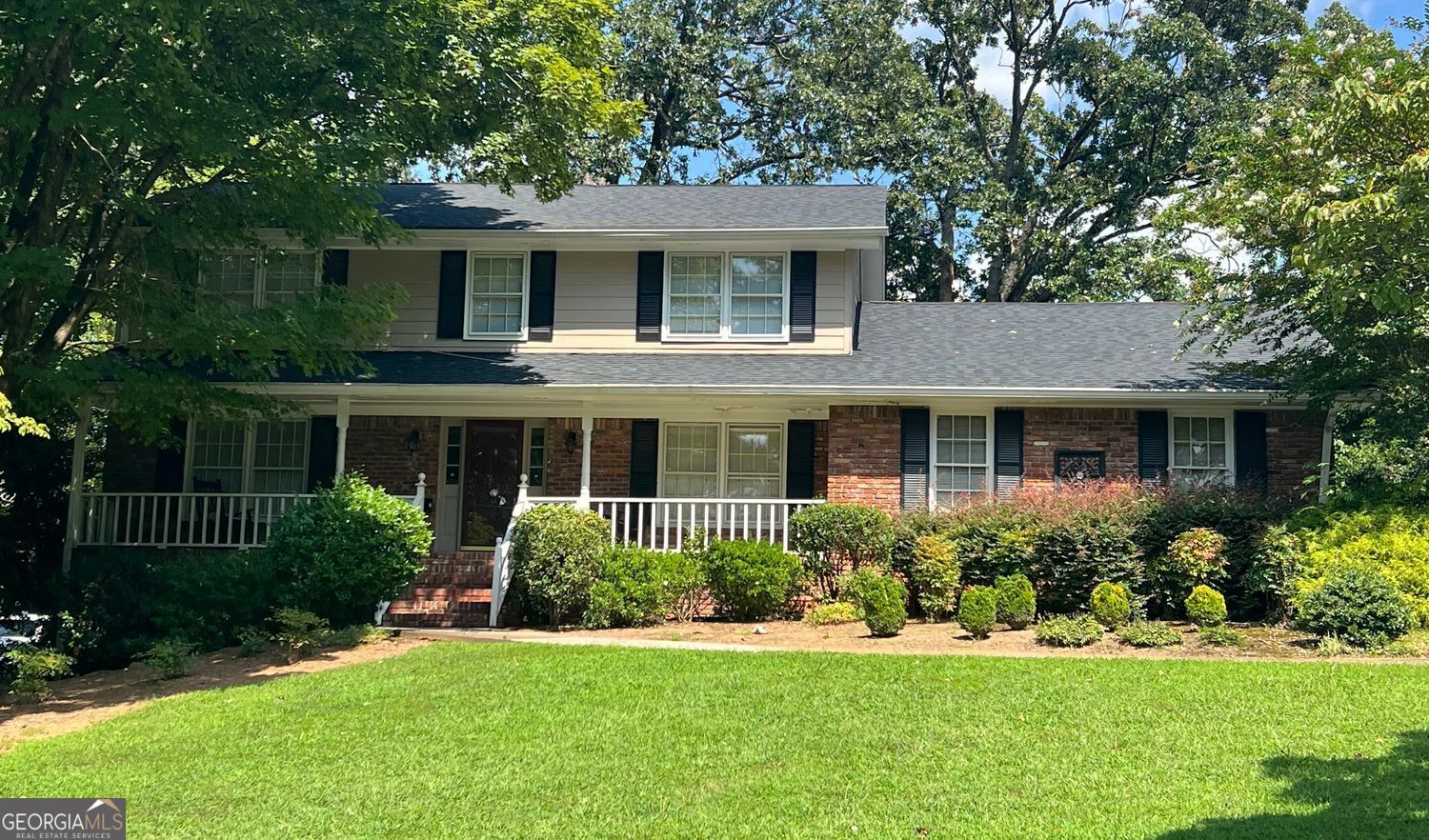 Nestled in the heart of Dunwoody in the popular Mount Vernon North community, this special home has been lovingly maintained and gently used over the years. The rocking chair front porch welcomes you in under the shade of mature foliage and year-round color. Over the threshold and into the hardwood foyer, you immediately feel the solid construction. Upscale features and finishes catch your eye, from high ceilings and oversized rooms to upscale moldings and perfectly positioned windows providing just the right amount of natural light. Neutral finishes, great bones, and wide room transitions surround you with so much potential as you move thru the living room and full-sized dining room. Wall-to-wall carpeting has carefully protected the site-finished hardwood floors underneath. The well-equipped, recently renovated kitchen features quartz countertops, stainless appliances, gas cooking, white cabinets, a white tile backsplash, marble floors, a precious bay window breakfast room overlooking the flowering back yard, and easy access to the laundry closet and 2-car side entry garage. The fireside den features built-in bookcases, a brick fireplace and mantle, gas starter, and walk-out access to the adorable screened porch and secluded back yard, all privately tucked inside thick greenery. Enjoy it just as it is, or replace screens with windows, add a wider transition from inside to out and transform this porch under the existing roofline into a magnificent sunroom expansion off the den. A large bedroom and beautifully renovated full bath round out the main floor offerings. Upstairs features more protected site-finished hardwoods under the carpet. Enter the enormous primary suite thru an entry alcove adorned with built-in bookcases, ideal for a quaint virtual office. This truly oversized owner's suite with walk-in closet is perfect as is or ripe for a primary bath expansion. Also upstairs, two sizeable secondary bedrooms and a full hall bath featuring sage green tile and a walk-in tub are perfect for a new owner with a design eye. A full unfinished daylight basement is just downstairs with interior and exterior access, rare for this neighborhood, and a blank canvas awaiting your creativity and providing loads of storage space or in the meantime. The possibilities are endless in this ideal, move-in ready home with a neutral palette and oversized rooms. For owners with vision, freshly paint, pull up carpets and refinish floors to further update before move in for even more upside. Or develop your vision, and then carefully complete your updates one at a time. Super clean and move-in ready, this home is walking distance to Dunwoody Village, a 5-minute bike ride to top-rated Vanderlyn Elementary, and a true once-in-a-lifetime opportunity to own a solid, well-maintained, close-in home with tons of future growth potential. Walk to upscale or casual dining, enjoy endless shopping and outdoor music venues, Dunwoody Nature Center, Spruill Gallery and Arts Center, movie theaters and groceries. Easy access to GA-400, I-285, Sandy Springs, and a quick shot to downtown Atlanta. This is a must-see quality home!