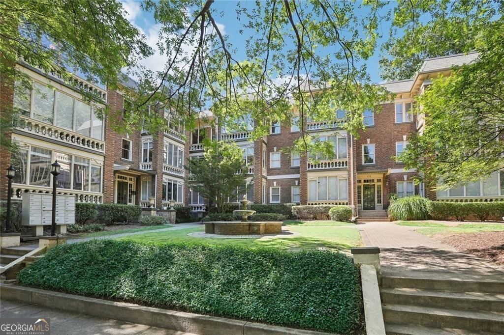 Old World charm integrated with glamourous updates and an unbeatable location. Your oasis in the city has a large sunroom with uninterrupted views of Piedmont Park, your "front yard." Highly sought after and rarely available large 2-BR open floor plan on the corner with huge windows on 3 sides adding sunshine in EVERY room. The best feature is the glass sunroom facing Piedmont Park that is heated and cooled for year-round enjoyment. Contemporary updates blend beautifully with 1900s charm: gorgeous original hardwood floors, and the updated kitchen features cream tossed marble tile countertop, a top of the line gas range, stainless steel appliances, and deep window sills overlooking the Midtown skyline. Separate dining room opens to a large living room opening to the sunroom for excellent flow when entertaining. Laundry room has a full-sized W/D and shelving for storage. Both bedrooms have custom wood blinds for each of the full windows + large custom closets. Included is (1) deeded parking spot + 1 lockable storage unit in basement. This gorgeous 100-year-old building was totally renovated in 2002 by the Walter Davis Group and unit #21 has not been on the market since then. Well run HOA replaced the roof 5 years ago and painted all the trim and hallways. Inside, the HVAC and water heater were replaced in 2019. Your $375 monthly HOA fee includes water, gas, trash, and exterior landscape and maintenance. Pet friendly building. Condo could be sold furnished. Live in the heart of vibrant Midtown and enjoy walking to local restaurants, all the events at Piedmont Park, the Beltline, the Arts Center and Marta. What a fantastic opportunity to own a corner unit in the Park View Condo at Piedmont Park!