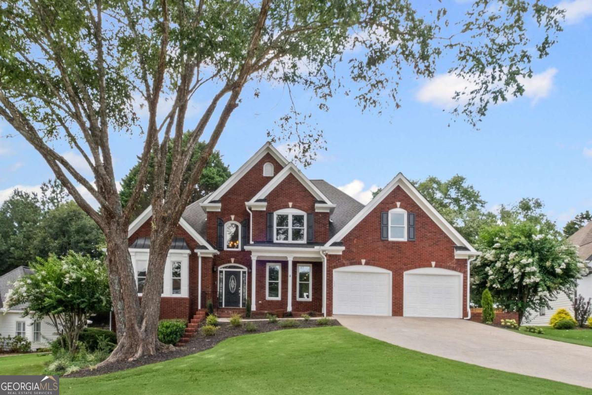 Welcome to this beautifully updated 5-bedroom, 3.5-bath home, with rocking chair front porch ideally located on a quiet cul-de-sac in the highly sought-after Polo Golf & Country Club and Vickery Elem / Middle & West Forsyth High School district. This move-in ready home boasts an open floor plan with vaulted ceilings, gorgeous hardwood floors throughout the main and upstairs level, new concrete siding, a new oversized deck and newer HVAC system. The heart of the home is the gourmet kitchen, featuring granite countertops, a tile backsplash, stainless steel appliances, pantry, and breakfast area-flowing seamlessly into a warm, vaulted fireside family room. The main-level owner's suite offers a spa-like bath and dual walk-in closets, creating a perfect retreat. Also on the main floor are a formal dining room, a separate living room or office, a spacious laundry room conveniently located near the kitchen, and a powder room. Step outside to the expansive deck, ideal for grilling and entertaining, overlooking your professionally landscaped, private backyard. Upstairs, you'll find three generously sized bedrooms and a full bathroom with dual vanities, perfect for family or guests. The finished terrace level adds even more living space, complete with LVP flooring, a bedroom, full bath, entertainment/media room, game area, walk-out access, and a 3rd-car garage. Two large unfinished areas offer ample storage or room for future expansion. Enjoy the incredible amenities of Polo Golf & Country Club, one of Forsyth County's premier communities. Membership options include access to; Championship golf course, Tennis complex, family pool with slide and snack bar, separate adult pool and onsite restaurant. With easy access to GA 400, top-rated schools, Vickery Village, the Greenway, parks, shopping, and dining-this home offers the perfect blend of luxury, location, and lifestyle.