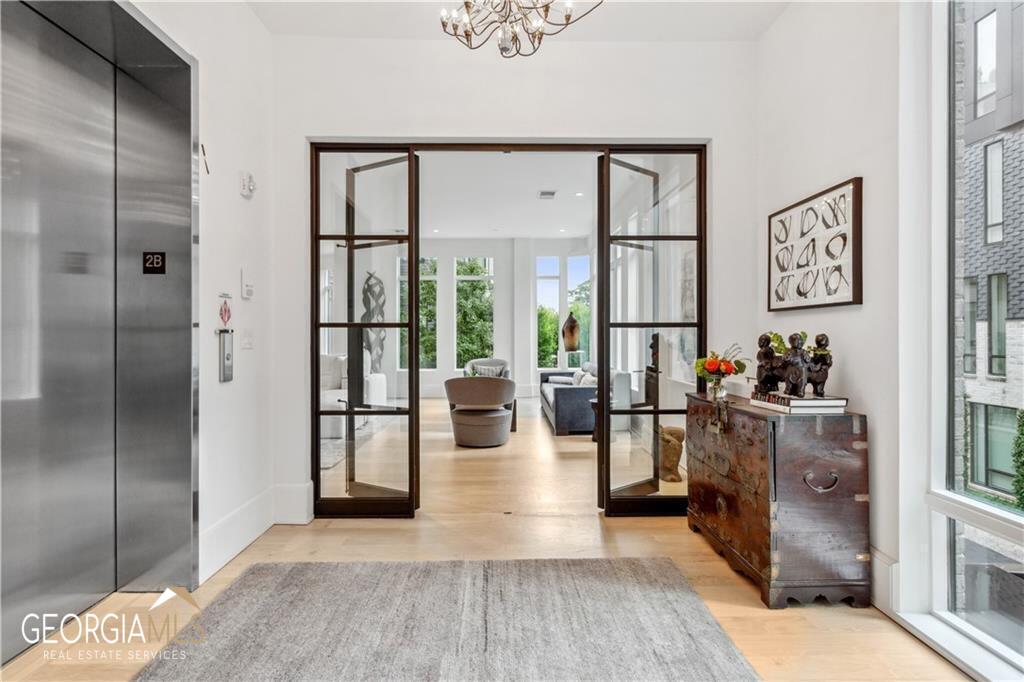 Supreme privacy in the most stellar Midtown location, welcome to ONE MUSEUM PLACE, John WeilandCOs most prized creation. An elegant, gated community of 44 homes, a perfect address for residents wanting discretion and privacy, along with an exceptional 24-hour concierge and on-site management. Enjoy being minutes away from the arts, wonderful dining, Piedmont Park, the Botanical Gardens and the Beltline, this area has so much to offer. Enter your home via a private elevator into your personal foyer, and into your unit with the highest quality of finishes and custom elements, including 10' ceilings and site finished oak hardwood flooring. This WHOLE FLOOR unit is UNIQUE, as it is a DOUBLE UNIT featuring TWO SPACIOUS ENTERTAINING AREAS and TWO OWNERS SUITES, plus a private office/media room, w/another full bath. This allows for open living & private areas, nothing better. One living area is anchored by the state-of-the-art Chef's kitchen which features a huge island, quartz counters, premium Gaggenau & SubZero appliances, great storage w/custom cabinets, wine cooler. On the other side of the unit, away from the Kitchen, the second living space for more formal entertaining if you so choose. Wet Bar located between both spaces. The beautiful Owners Suite features a sleek spa bath w/double vanity, soaking tub, frameless shower w/2 heads, dual walk-in closets & a private outdoor Lanai area w/gas grill & wet bar. There are two additional Ensuite Bedrooms, & large Laundry. Secure parking in the drive under garage, your unit offers 3 interior garage spots, as well as multiple charging stations. Guests are always welcome, can stay in the Guest Suite, & there is plenty of on-site parking. OMP is very pet friendly & has its own Dog Park. This is it, luxury living in an architecturally significant community w/impeccable amenities, a very special address, ONE MUSEUM PLACE.