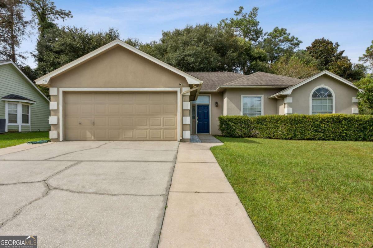 This well maintained home has a 6 year old 30 year Architectural shingle roof, New AC Units, giving you peace of mind. This home offer 4 spacious bedrooms and 2 full bathrooms, Carpet can only be found in the Bedrooms, the large open living space is perfect for day to day living or a family gathering, it includes a cozy feel when the Fireplace is lit and easy to maintain flooring. The 2-car garage gives plenty of storage. This home blends comfort, functionality and centrally located to shopping, schools and 1-95 for a trip to either Jacksonville or Brunswick.