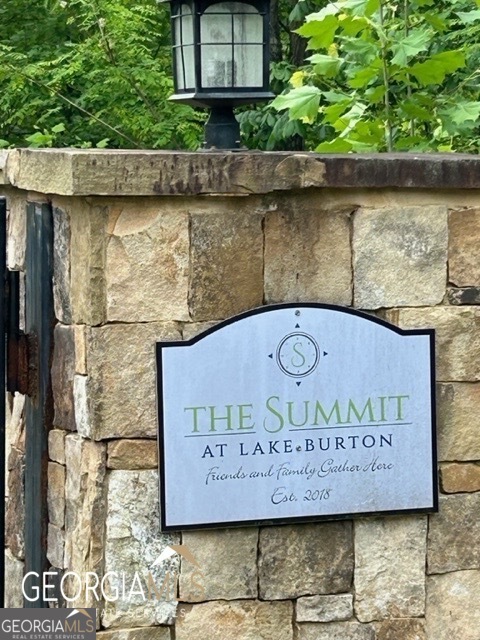 This property at The Summit at Lake Burton offers stunning, seasonal, lake and mountain views. On a spacious 1.64-acre lot, making it an ideal location to build your dream lake house. The area provides convenient access to rivers, lakes, dining, shopping, boating, hiking, and world-class fly fishing, allowing you to enjoy the natural beauty and outdoor adventures of NE Georgia Mountains. It's perfect for those seeking a serene retreat with all the amenities and outdoor activities at their doorstep.