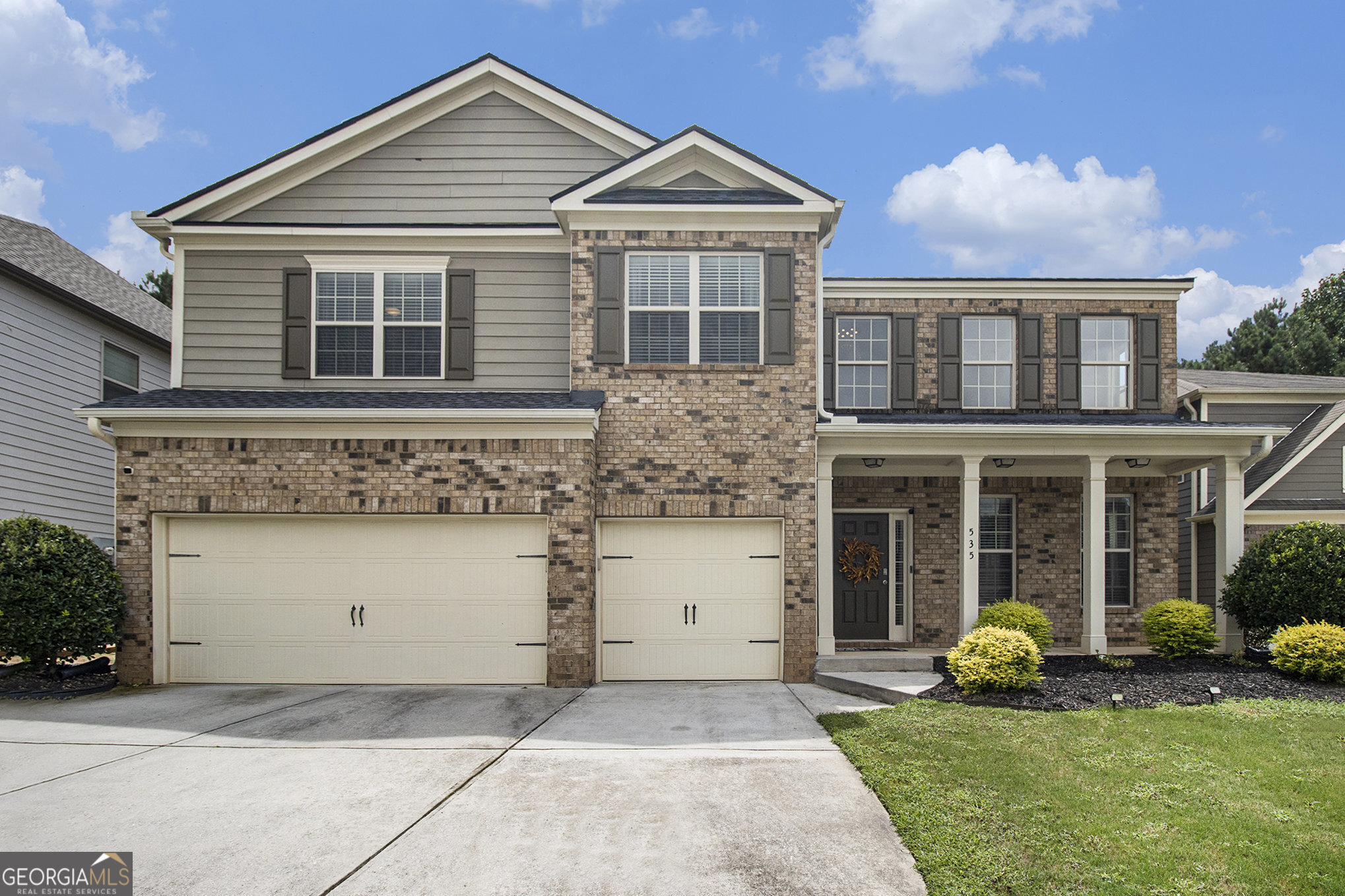 Immaculate and barely lived in, this stunning 5-bedroom, 4-bath brick-front beauty blends timeless elegance with modern comfort. From the moment you enter, you're greeted by a breathtaking grand 2-story living room flooded with natural light and a formal dining room adorned with elegant coffered ceilings - perfect for hosting memorable gatherings. The inviting family room, anchored by a warm fireplace, flows effortlessly into the chef-inspired eat-in kitchen, featuring rich stained cabinetry, gleaming granite countertops, a spacious breakfast bar, and a center island ideal for casual dining or meal prep. A private main-level bedroom with full bath is perfect for guests or multigenerational living. Upstairs, escape to the oversized owner's retreat with a large sitting room and its own cozy fireplace - a true sanctuary. The spa-like bath offers the perfect place to unwind after a long day. Three additional bedrooms, two full baths, and a versatile loft space provide room for everyone. Enjoy peace of mind with a brand-new roof and the opportunity to personalize with a paint allowance. Step outside to a fenced backyard ready for play, pets, or weekend BBQs, all within an established community known for its charm and convenience. Ideally located just minutes from major interstates and Hartsfield-Jackson Atlanta International Airport, this home offers the perfect blend of tranquility and accessibility.