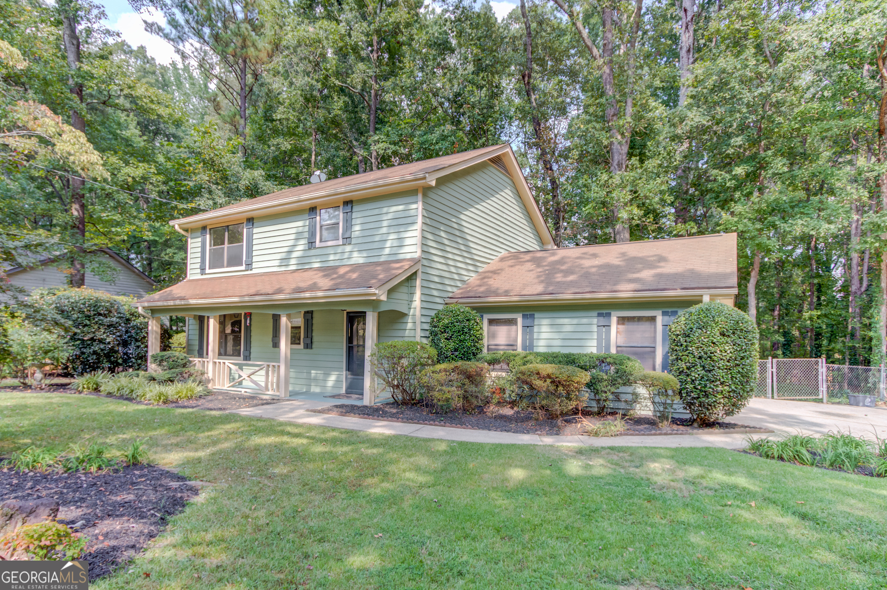 Welcome to 2405 Ivy Way, nestled on a quiet cul-de-sac street in Snellville. This inviting 3-bedroom, 2.5-bathroom home offers comfortable living with thoughtful updates throughout. Inside, you'll find fresh paint and a spacious living room that's perfect for relaxing or gathering with family and friends. The kitchen is equipped with stainless steel appliances and features a cozy eat-in dining area for everyday meals. Upstairs, the primary suite includes a walk-in closet and walk-in shower, while two secondary bedrooms also offer walk-in closets and share a full bathroom. The laundry room is conveniently located upstairs as well. Outdoor living is a true highlight of this home. A rocking chair front porch welcomes you at the entry, while the large screened-in back porch with skylights and an oversized deck with built-in seating provide the perfect spots for entertaining or enjoying peaceful evenings overlooking the fenced backyard. This move-in ready home combines comfort, charm, and convenience. schedule your private showing today.