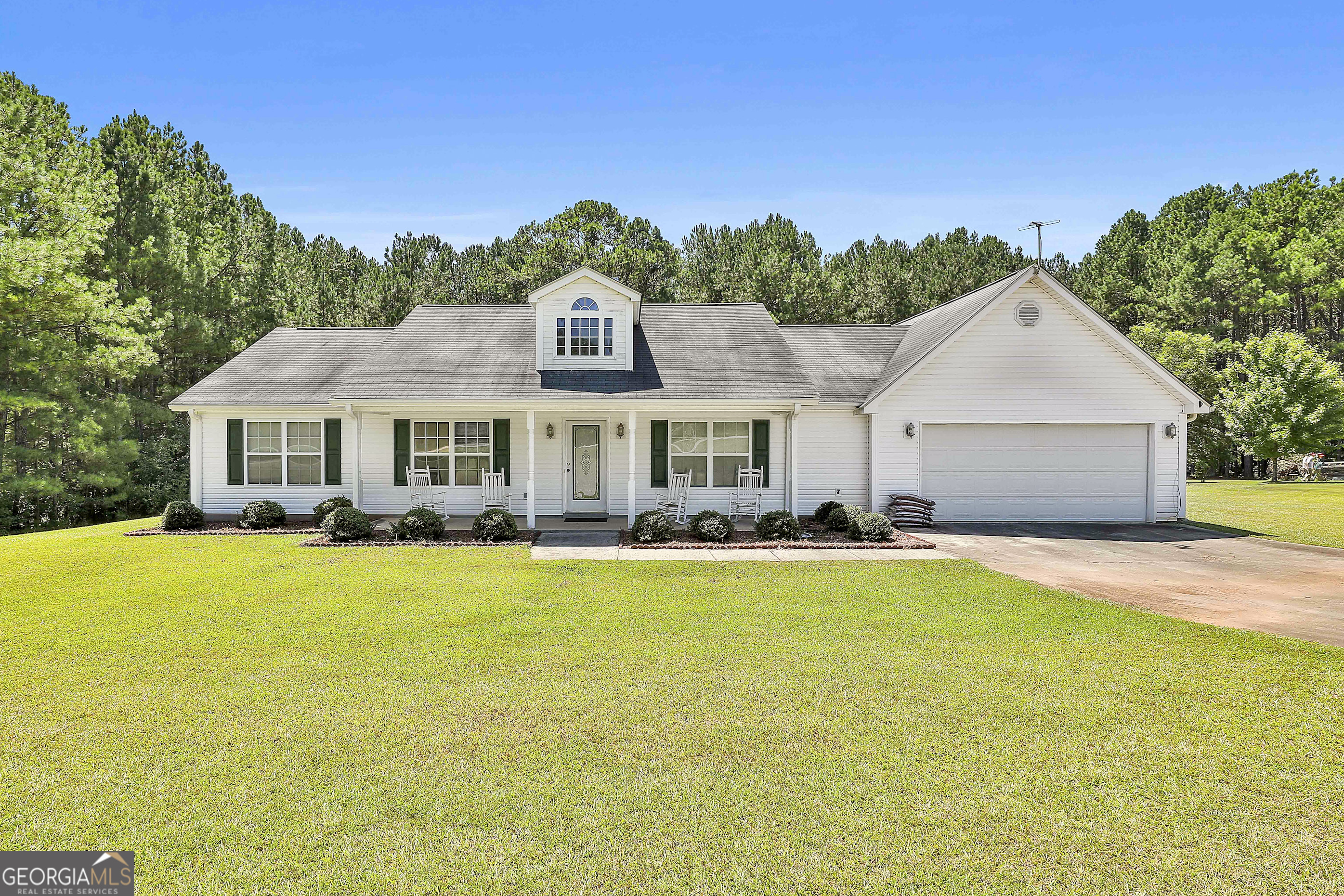 This beautifully maintained 4 bedroom, 2 bath ranch-style home offers the perfect blend of comfort, charm, and functionality! Step inside to discover an open floor plan that seamlessly connects the living, dining, and kitchen areas, creating a warm and inviting atmosphere ideal for both everyday living and entertaining. Large windows fill the home with natural light, while the thoughtful layout ensures convenience and flow throughout. The spacious kitchen offers plenty of cabinet and counter space, making meal prep easy and enjoyable. Just off the kitchen, the living room provides a comfortable place to relax and unwind with family and friends. The master suite is generously sized with a private bath, while the additional bedrooms offer flexibility for family, guests, or even a home office. Outside, you'll find a large front yard that enhances curb appeal and a spacious backyard that provides endless possibilities. Whether you envision summer barbecues, a play area, a garden, or simply a quiet retreat, this yard delivers the space you've been looking for. Located in desirable Coweta County, this property combines privacy and space with the convenience of being close to schools, shopping, dining, and all the amenities the area has to offer. Call The Charles Davis Team today to get more information and schedule a showing!