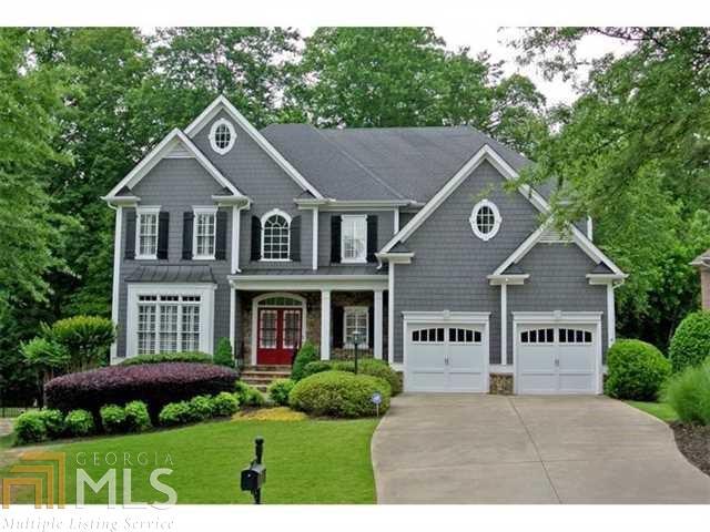 Unbeatable price for pristine home in sought-after gated John's Creek community. Expertly built by Robert Harris Homes, this elegant 4 Bedroom home features a gourmet kitchen with JennAir appliances, granite counters and a beautiful brick backsplash. The large family room has a soaring wall of windows and a cozy fireplace. A study with French doors, formal dining room and living room complete the main floor space. The upstairs master suite features a fireside sitting room and beautiful ensuite bath. Basement ready to finish. Spectacular outdoor living on large deck overlooking private yard.