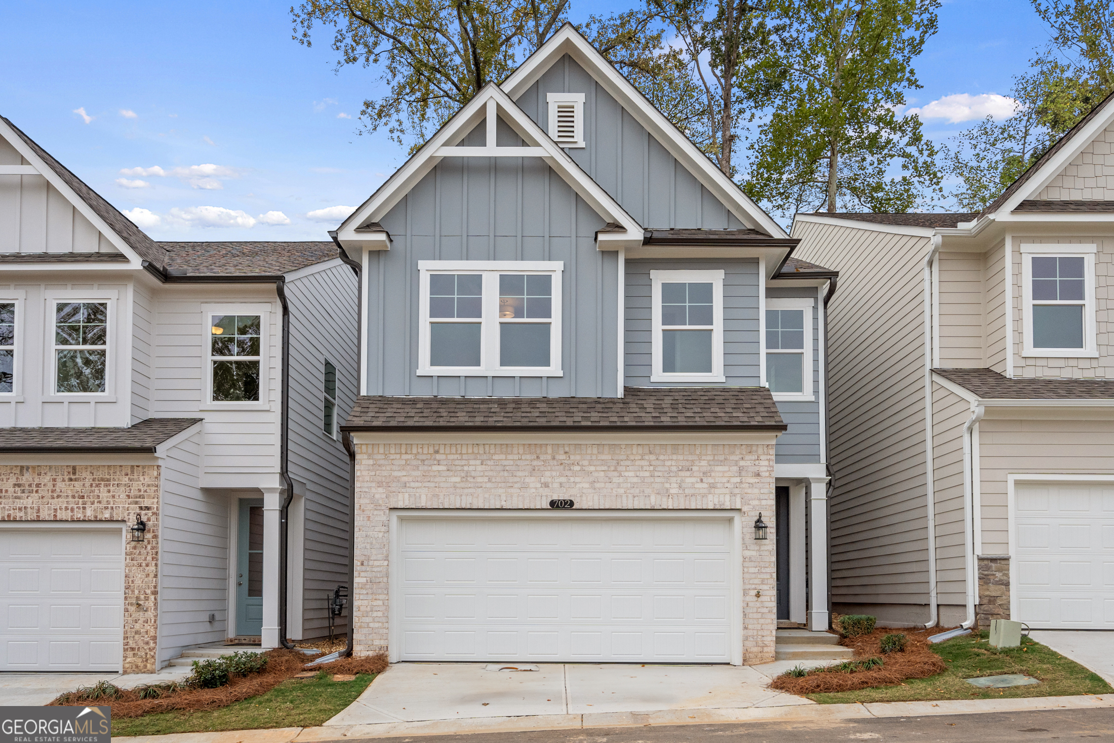HURRY, FEW HOMES LEFT! Welcome to The Cary A lot 41, a stunning 3-bedroom, 2.5-bath residence in the sought-after GATED Village at Shallowford just steps from pool and clubhouse. This move-in-ready home spans 2,008 sq ft, combining elegance with practicality. The open layout invites you into a bright foyer leading to a gourmet kitchen with 10 FT island, 42" cabinets, gleaming granite countertops, and top-of-the-line stainless-steel appliances. Relax in the cozy living room, complete with a charming shiplap fireplace and 9 FT ceilings throughout the main level, or entertain guests in the adjoining dining room with easy access to the private patio. Retreat to the oversized primary suite, offering a luxurious extended tile shower and a walk-in closet, providing a peaceful escape from the secondary bedrooms. Enjoy the open railing staircase that adds a feeling of light and spaciousness and oak treads on the stairs enhance the sophisticated ambiance. Set within the ONLY gated community with a pool and clubhouse in Kennesaw, enjoy quality amenities and proximity to excellent schools. With its charming exteriors and open floor plans, this home is a true gem. Check this link for our current National Sales Promo www.davidsonhomes.com/states/georgia/atlanta-market-area/kennesaw/the-village-at-shallowford/