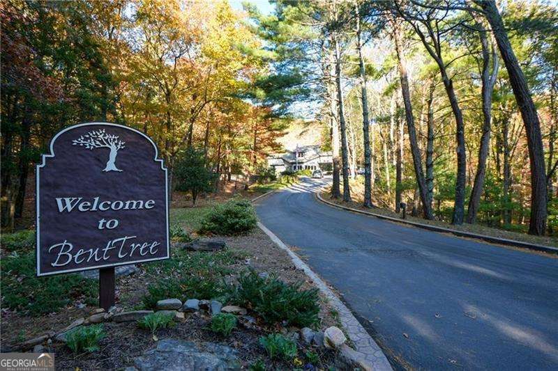 Discover this beautiful .99-acre daylight basement lot with a southeast exposure offering long range winter VIEWS!!! Perfect for building your dream home in a peaceful, private setting. A favorable soil test is on file, helping to insure a smooth building process. Not ready to build yet? There is no time limit to build after purchase so you can secure today's prices and build when the time is right. Bent Tree is a 3500-acre gated mountain community approximately an hour north of Atlanta, offering a wealth of amenities. Challenge yourself to a round of golf on the Joe Lee-designed 18-hole course, dip in one of the two pools, or a match on the indoor/outdoor tennis/pickleball courts. For the water lovers, the pristine 110-acre Lake Tamarack offers excellent boating and fishing opportunities. After a day of recreation, relax and enjoy a delicious meal at the Tavern. Bent Tree has an equestrian center, hiking trails for staying fit and many social events and clubs. Your mountain lifestyle starts here!