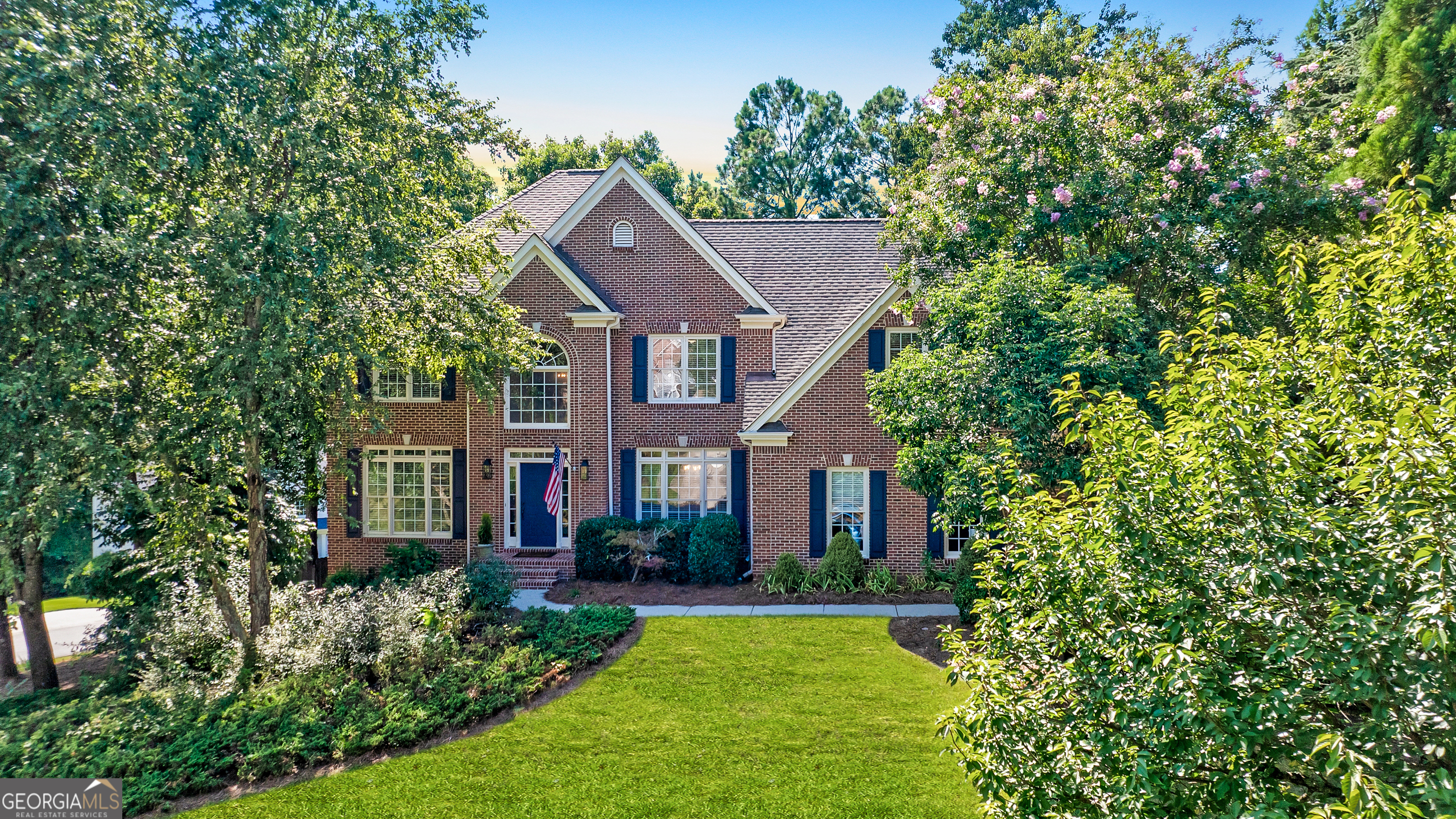 Welcome to this beautifully maintained 5 bedroom, 5 bathroom traditional brick-front home, located in the highly sought-after Shiloh Farms swim/tennis community. This neighborhood is well known for being in a prime Alpharetta location and with Forsyth County tax incentives. Thoughtfully updated, this home features freshly stained hardwood flooring, new carpet and interior paint, enhancing the bright and inviting atmosphere. Step inside to discover a spacious and open floor plan that seamlessly blends style and functionality. The formal living and dining rooms provide elegant spaces for hosting, while the two-story fireside family room features soaring ceilings and abundant natural light, creating an inviting and airy feel. The kitchen features granite countertops, bar seating, ample cabinetry, work station, walk-in pantry and an adjoining spacious deck, the perfect spot to enjoy your morning coffee or unwind after a long day. Upstairs, the oversized primary suite serves as a tranquil retreat, complete with hardwood flooring, an updated en suite bathroom featuring a generous double vanity and walk-in closet. The spacious secondary bedrooms feature 2 private bedroom en suites and 2 bedrooms with an adjoining jack and jill bathroom offering comfort and versatility, making them ideal for guests, family, or a home office. The Terrace level offers additional living space featuring a media room, exercise room, dry bar area, renovated full bath, workshop and ample storage areas. Outside, the fenced backyard and deck with steps to grade provide an ideal setting for outdoor entertaining, grilling, or simply enjoying a peaceful escape. Residents of Shiloh Farms enjoy fantastic amenities, including a clubhouse, pool, tennis courts, playground and top-rated schools. Conveniently located near GA400, world-class shopping and restaurants at Alpharetta City Center, Avalon, Halcyon, Cumming City Center and The Collection.