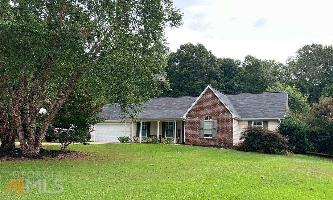 Beautiful single story home in sought after location only a few minutes to downtown Senoia. Spacious open floor plan with vaulted family room features cozy brick fireplace and opens directly to the Kitchen and breakfast area, great for entertaining family and friends. Large Owners bedroom with vaulted ceiling walk in closet and attached bath with separate shower and large garden tub idea for relaxing after a long day. House has NO CARPET all laminate or tile throughout for easy maintenance. Nice size secondary bedrooms with direct access to a hall bath. Attached 2 car garage and separate poured parking pad on the side of the house to park and additional car or boat. Large fenced yard very private with patio area great space for cookouts or relaxing. Recent updates include: a newer roof 5 years old , hot water heater 3 years old. This home is a must see. Ideal location near shopping, schools with easy access to Senoia, Sharpsburg and Peachtree City. EASY TO SHOW ANYTIME!