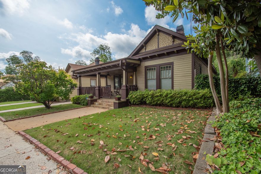 Charming Renovated Historic Home in Downtown Newnan - Walk to the Square! Located in the heart of Downtown Newnan, this beautifully updated historic home blends timeless charm with modern convenience. Just a short walk to shopping, dining, and the vibrant local scene! Step onto the inviting front porch and into a spacious foyer that can serve as an office or sitting room. A classic pocket door leads to two bedrooms and a full bath. The open-concept living area features stunning doors that lead to the family room, dining area, and kitchen-perfect for entertaining. The private owner's suite offers a peaceful retreat, and a separate mud/laundry room provides practical everyday function. Enjoy the fenced backyard, large deck, and a detached garage/workshop with electricity. Situated near East Broad Street with exciting future development planned. This home offers incredible investment potential. Priced under $500K, it's a rare opportunity to live and invest in the City of Newnan!
