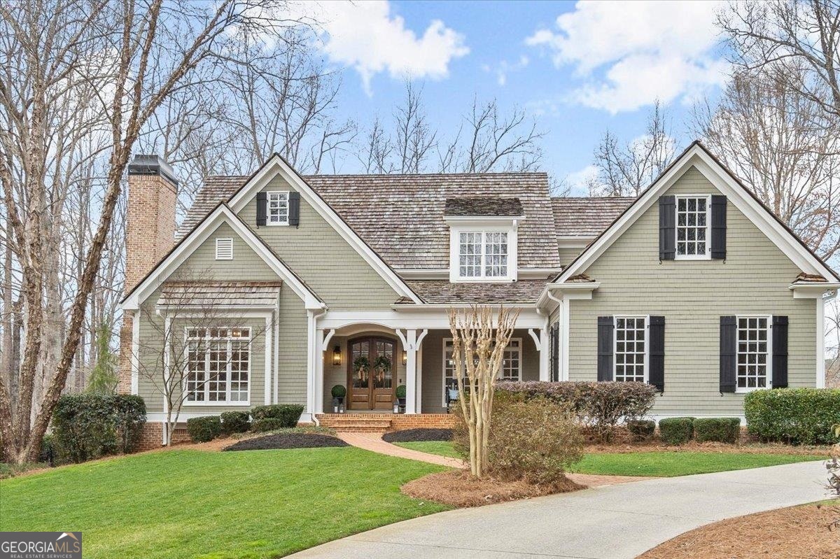Discover this gem in Cobblestone Farms - one of Milton's original neighborhoods featuring an enclave of 14 custom homes with timeless designs. This "larger than it looks" residence offers the perfect blend of functionality and style, featuring a desirable master suite on the main level with views of the backyard & pool. Upstairs, discover 4 generously sized bedrooms / 3 full baths / and a bonus room to accommodate family members or guests. One bedroom could even serve as a secondary master bedroom if needed. Experience the luxury of an exceptional main level floor plan with abundant rooms: from a welcoming 2-story foyer to spacious fireside living areas, dining spaces, and a dedicated home office/study. Start your day with a cup of coffee on the cozy screened-in porch just off the kitchen, or sip refreshing cocktails on the expansive Brazilian walnut deck overlooking the the backyard/pool as the day transitions. The heart of the home is the gourmet kitchen equipped with high end appliances, granite countertops, plenty of cabinet space, and a spacious center island. The adjoining breakfast and keeping room provide a large, versatile space for casual dining, family gatherings or entertaining guests. A laundry/mudroom is conveniently located between the 3-car garage and kitchen with a separate entrance - a perfect transition space for a "drop zone". Indulge in the ultimate entertainment experience with your very own pub-like bar in the basement playing pool, darts or watching the game on the 110" projection screen. There are two additional rooms that are currently serving as a second office and a workout room. Either of these spaces could be tailored to suit your specific needs. Out back is your own slice of paradise, where every day feels like a vacation! You'll step into an extraordinary pool area and backyard that blends relaxation, entertainment and recreation. Adjacent to the stunning, 9 ft deep saltwater pool & hot tub is an outdoor fireplace and a covered patio & bar with a grill/green egg/refrigerator. Whether lounging poolside, gathering around the fireplace, or enjoying a friendly game in the yard - you'll enjoy every moment spent in this outdoor paradise!