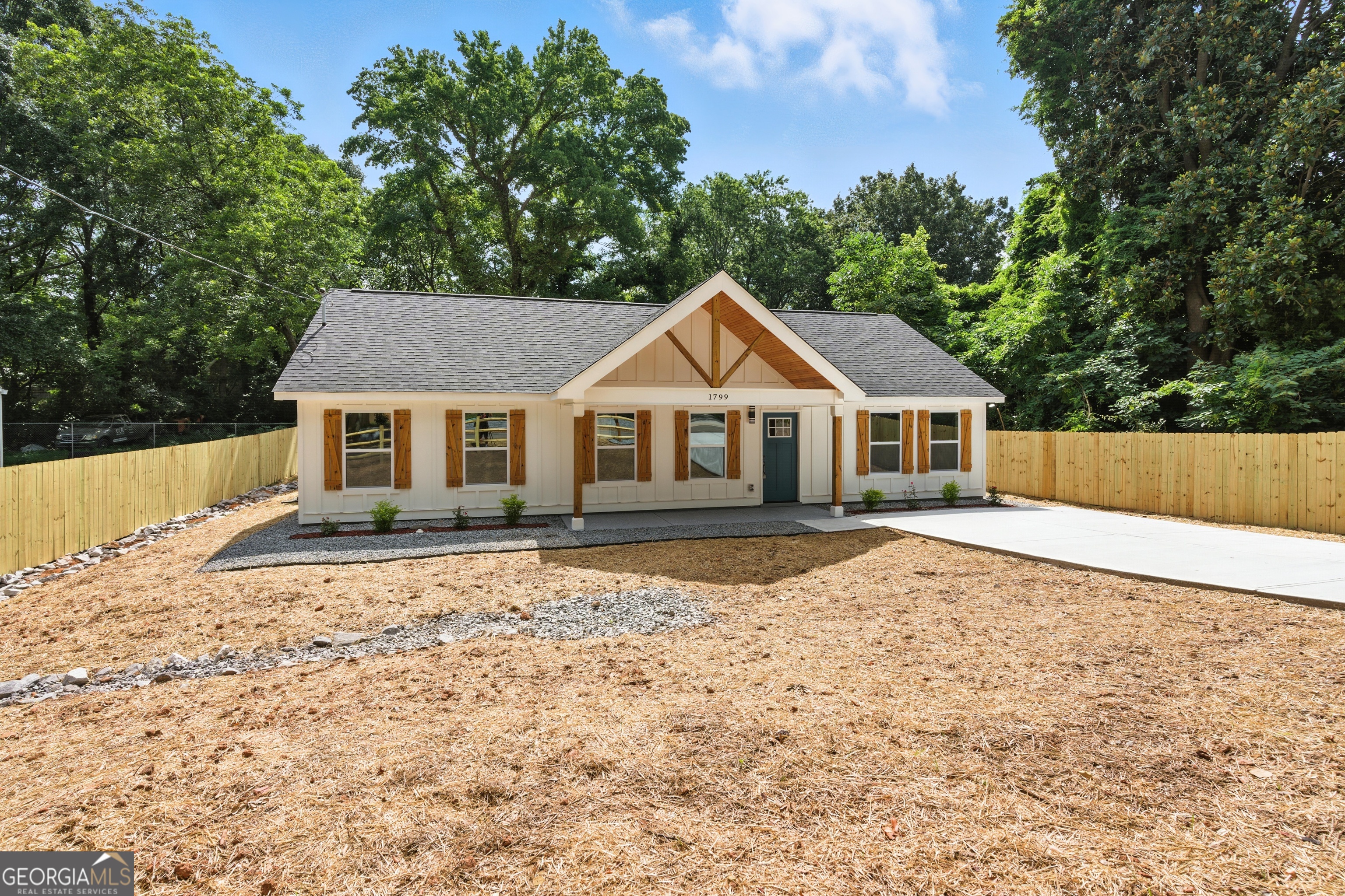 Welcome Home to 1799 Clearview St SE- A Brand-New Construction Filled With Style and Serenity Step into a story of comfort, elegance, and modern charm - right in the heart of Marietta. From the moment you arrive at this freshly built home, the beautifully designed exterior with warm wood accents and a spacious fully fenced backyard sets the tone for what's inside: a space made to inspire. As you cross the threshold, you're welcomed by clean lines, elevated finishes, and a seamless open floor plan. The heart of the home is the breathtaking kitchen - a true showstopper - featuring a quartz waterfall island with natural wood detail, statement pendant lighting, sleek white cabinetry, and stainless steel appliances. It's the kind of kitchen that invites conversations, morning coffees, and memorable dinners. The bathrooms carry a spa-like serenity, with marble-style tiles, matte black fixtures, and modern vanities that blend function with flair. Every corner of this home has been thoughtfully crafted - from the wide-plank flooring to the spacious bedrooms and the abundance of natural light that floods every room. The fully fenced backyard offers a private haven - ideal for pets, family gatherings, or simply enjoying your own slice of nature. And location? You're minutes from Marietta Square, a vibrant mix of local shops, dining, parks, and cultural events. Spend your weekends at local farmers markets, walking trails, or exploring the rich history of this beloved area. Easy access to major roads makes commuting a breeze while still offering the quiet of a residential neighborhood. This isn't just a house. It's where your next chapter begins - beautifully, comfortably, and completely yours. Come experience the magic of 1799 Clearview St SE - and fall in love, room by room.