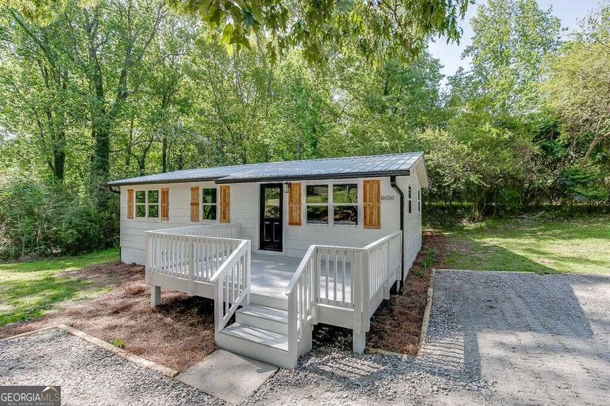 An absolutely charming and wonderfully updated home! Enjoy the countless updates and upgrades such as a new roof, HVAC, windows, fixtures, Quartz countertops, Stainless Steel appliances, LVP flooring and more! No detail overlooked in this better-than-new home! Perfectly situated close to shopping, dining and entertainment in Dawsonville, Gainesville and Cumming. This is a rare find in the highly sought after East Forsyth county district, located 1/2 mile from beautiful Lake Lanier and boating, swimming and park access at Keith Bridge park!